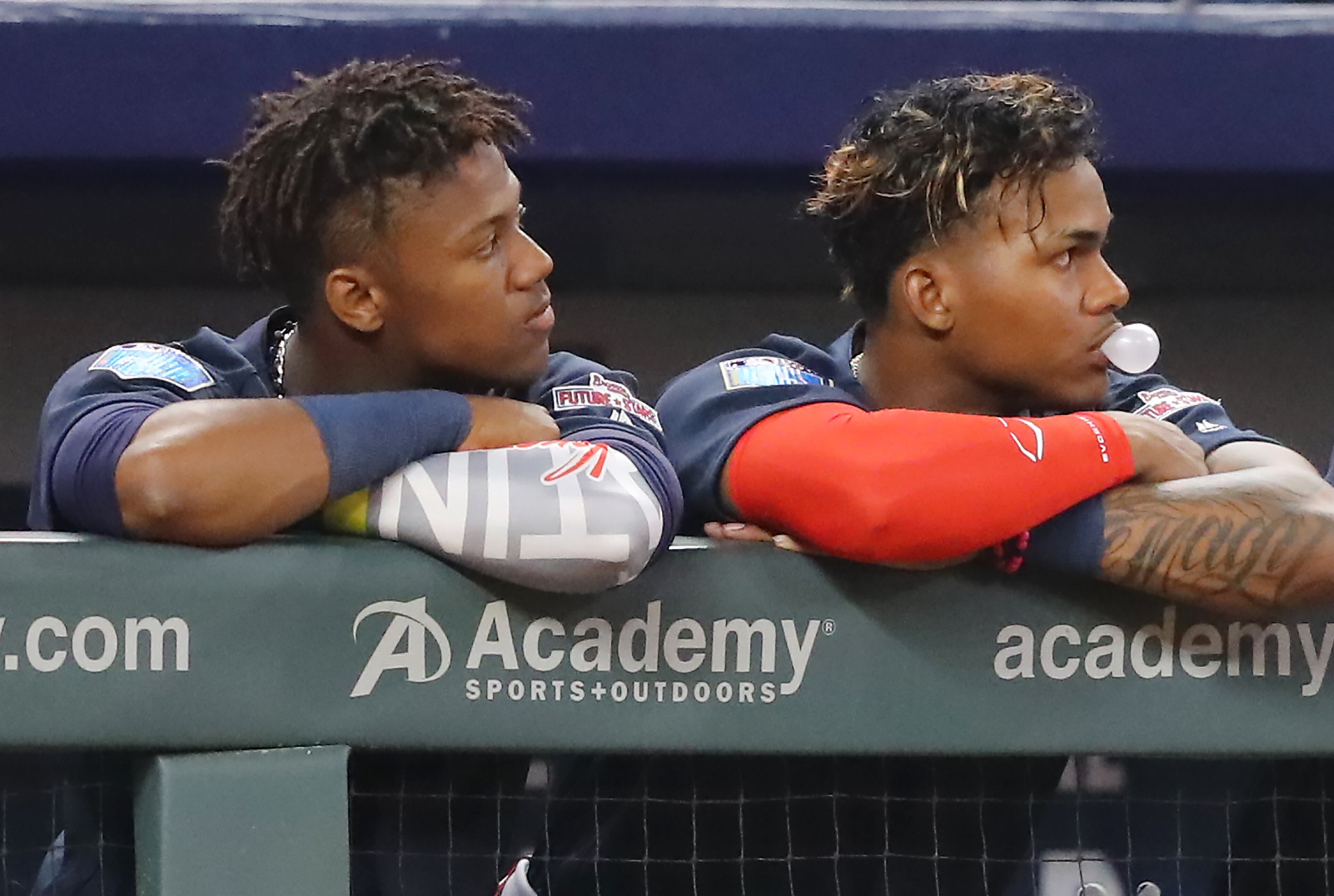 March 27, 2018 Atlanta: Ronald Acuna Jr., and Cristian Pache watch the action from the dugout after being replaced in the game during the sixth inning of the Future Stars Exhibition Game on Tuesday, March 27, 2018, at SunTrust Park in Atlanta. Curtis Compton/ccompton@ajc.com