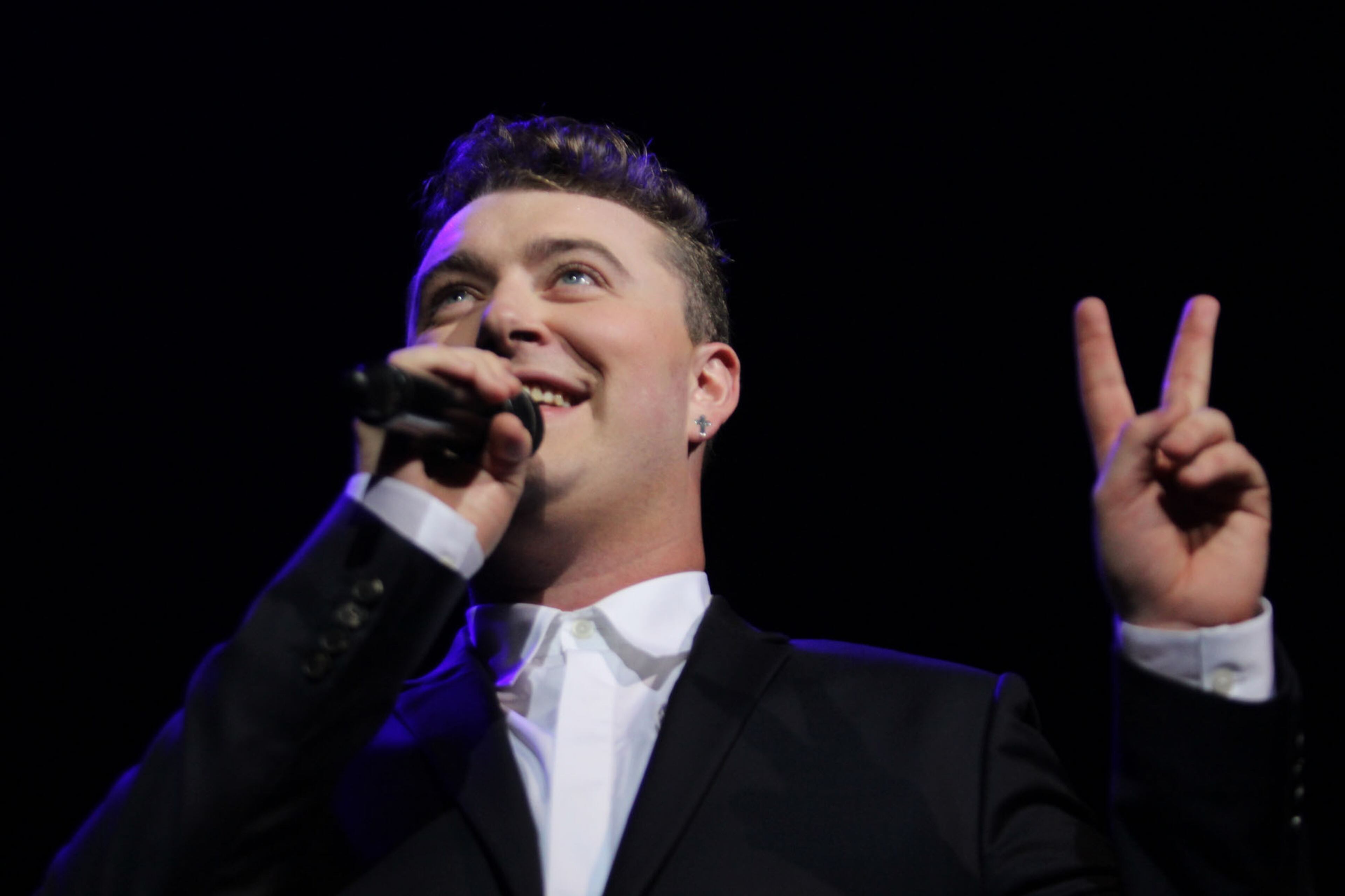 British soul singer Sam Smith performs for a sold-out audience Monday, Oct. 6, 2014 at the Tabernacle in Atlanta. Smith holds up two fingers in reference to his where his debut album, "Lay Me Down," reached on U.S. charts. (Akili-Casundria Ramsess/Special to the AJC) (Akili-Casundria Ramsess/Special to the AJC)