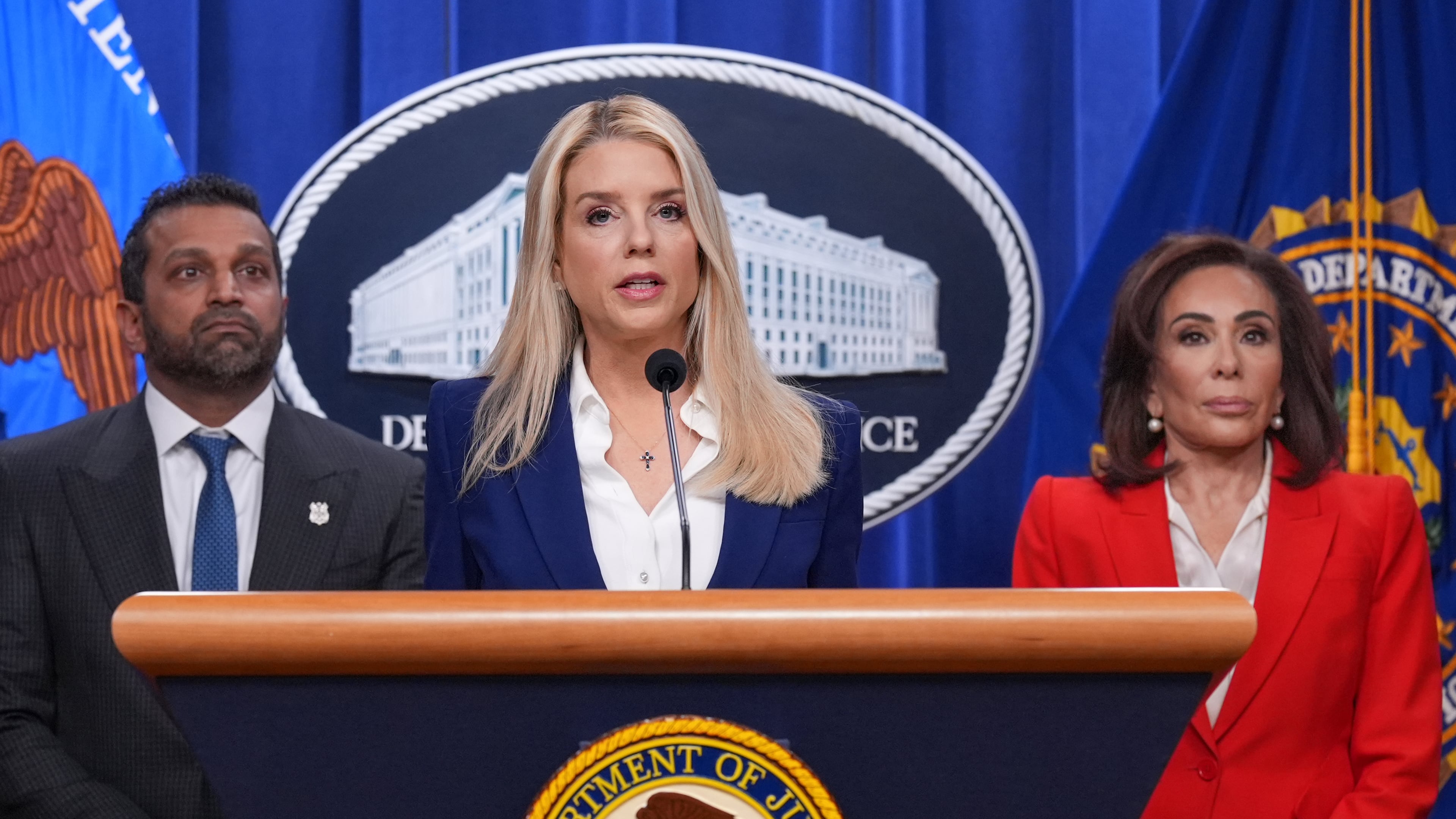 Attorney General Pam Bondi, joined at left by FBI Director Kash Patel, and Jeanine Pirro, U.S. Attorney for the District of Columbia, appear before reporters at the Justice Department, Friday, Feb. 6, 2026, in Washington, to announce the capture of a key participant in the 2012 attack on a U.S. compound that killed four Americans in Benghazi, Libya. (AP Photo/J. Scott Applewhite)