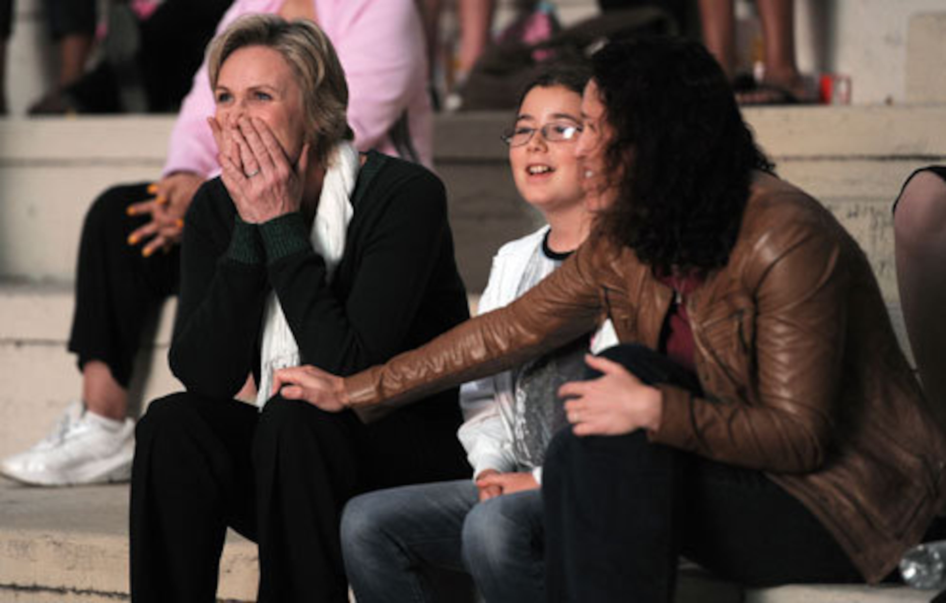 Jane Lynch reacts as she watches herself in a scene from "Glee."