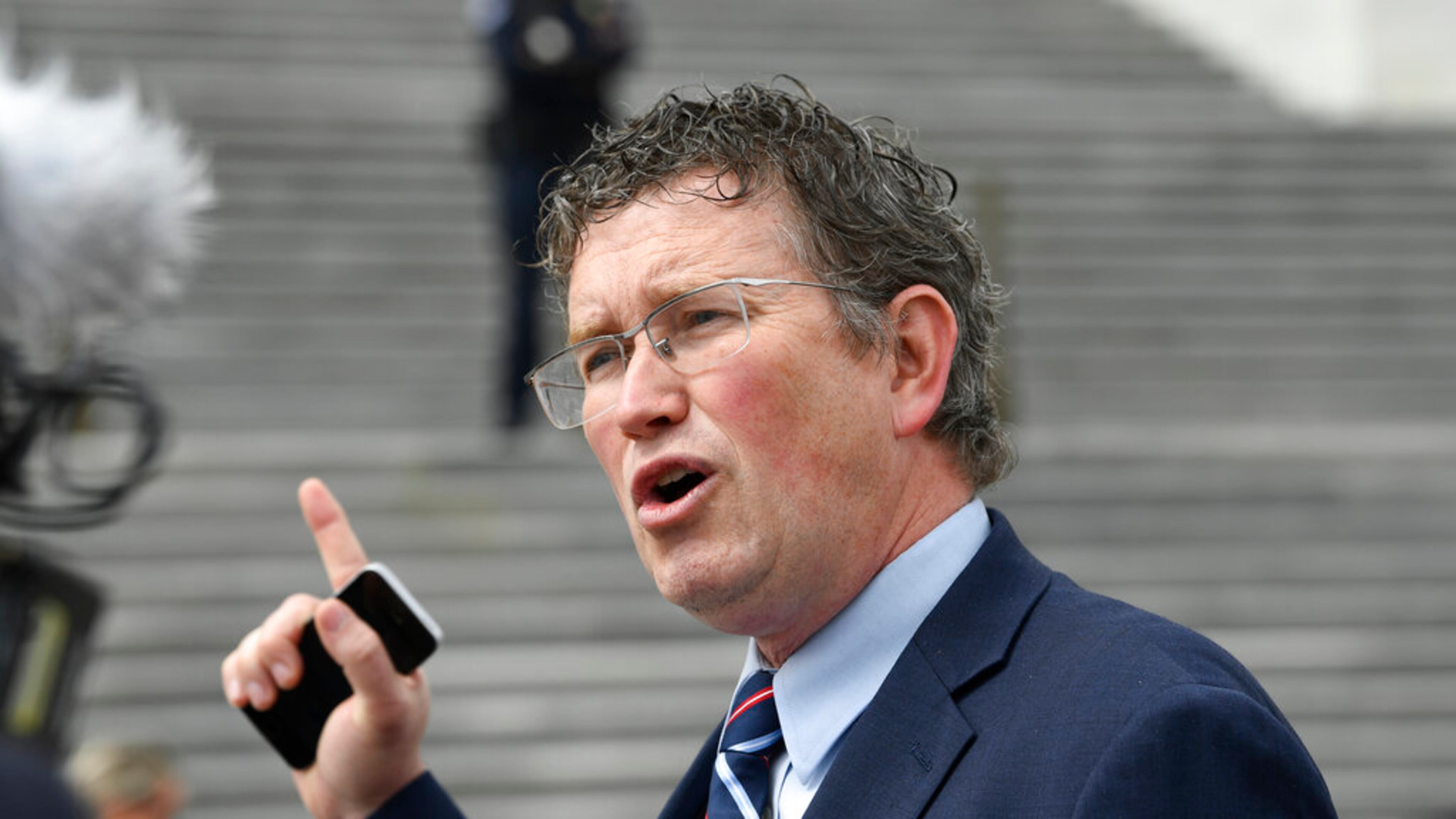 FILE - In this March 27, 2020 file photo Rep. Thomas Massie, R-Ky., talks to reporters before leaving Capitol Hill in Washington. Massie, a Kentucky congressman said Kyle Rittenhouse charged with fatally shooting two people with a semi-automatic rifle during the unrest in Wisconsin showed “incredible restraint" and acted in self-defense. (AP Photo/Susan Walsh, File)