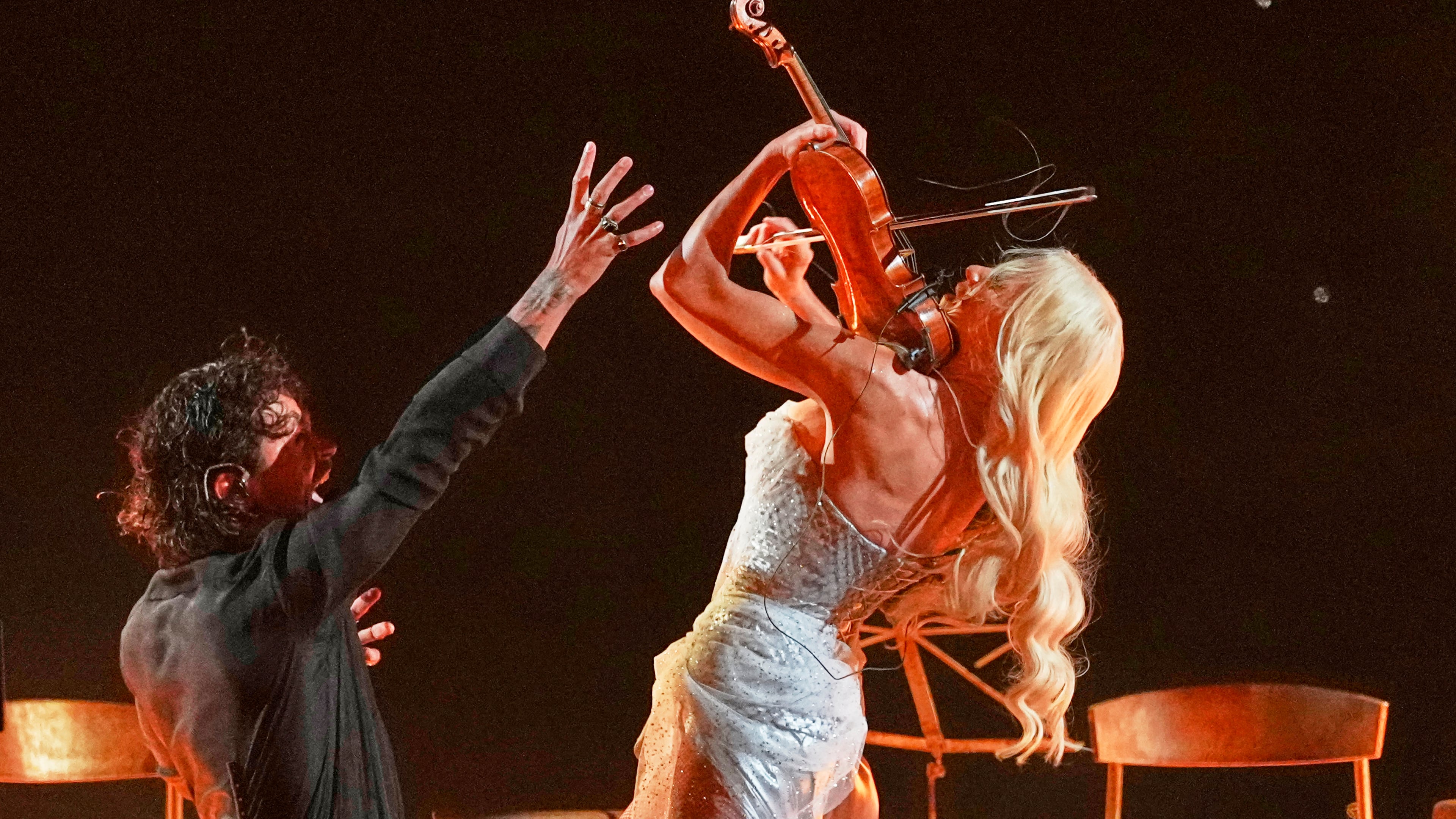 Linda Lampenius and Pete Parkkonen from Finland perform the song "Liekinheitin" during the first semifinal of the 70th Eurovision Song Contest in Vienna, Austria, Tuesday, May 12, 2026. (AP Photo/Martin Meissner)