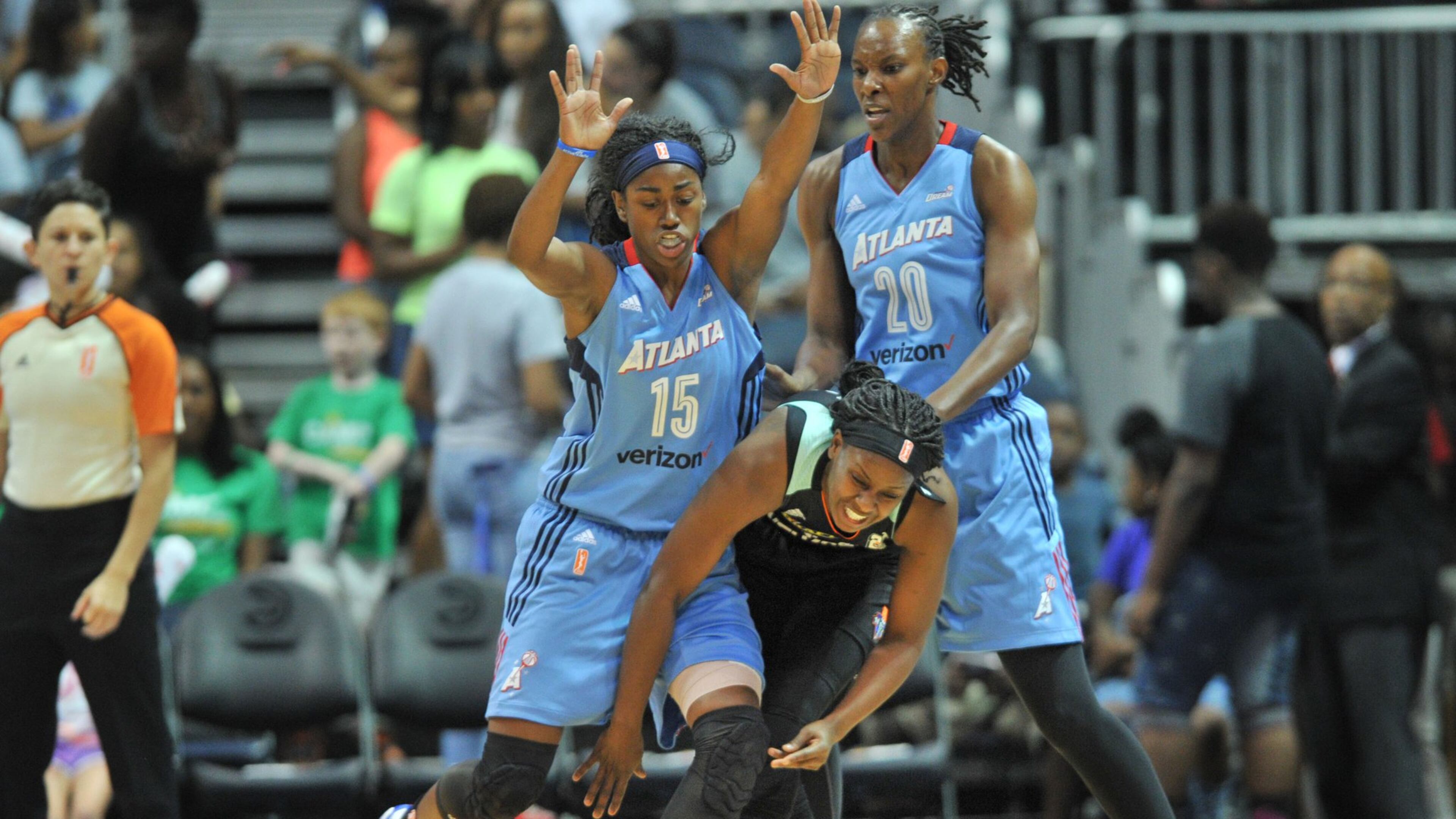 New York Liberty guard Sugar Rodgers (14) gets off a pass under pressure from Atlanta Dream guard Tiffany Hayes (15) and Atlanta Dream forward Sancho Lyttle (20) in Atlanta Dream 90 - 79 loss to the New York Liberty after two extra periods at Philips Arena on Wednesday, June 22, 2016. HYOSUB SHIN / HSHIN@AJC.COM
