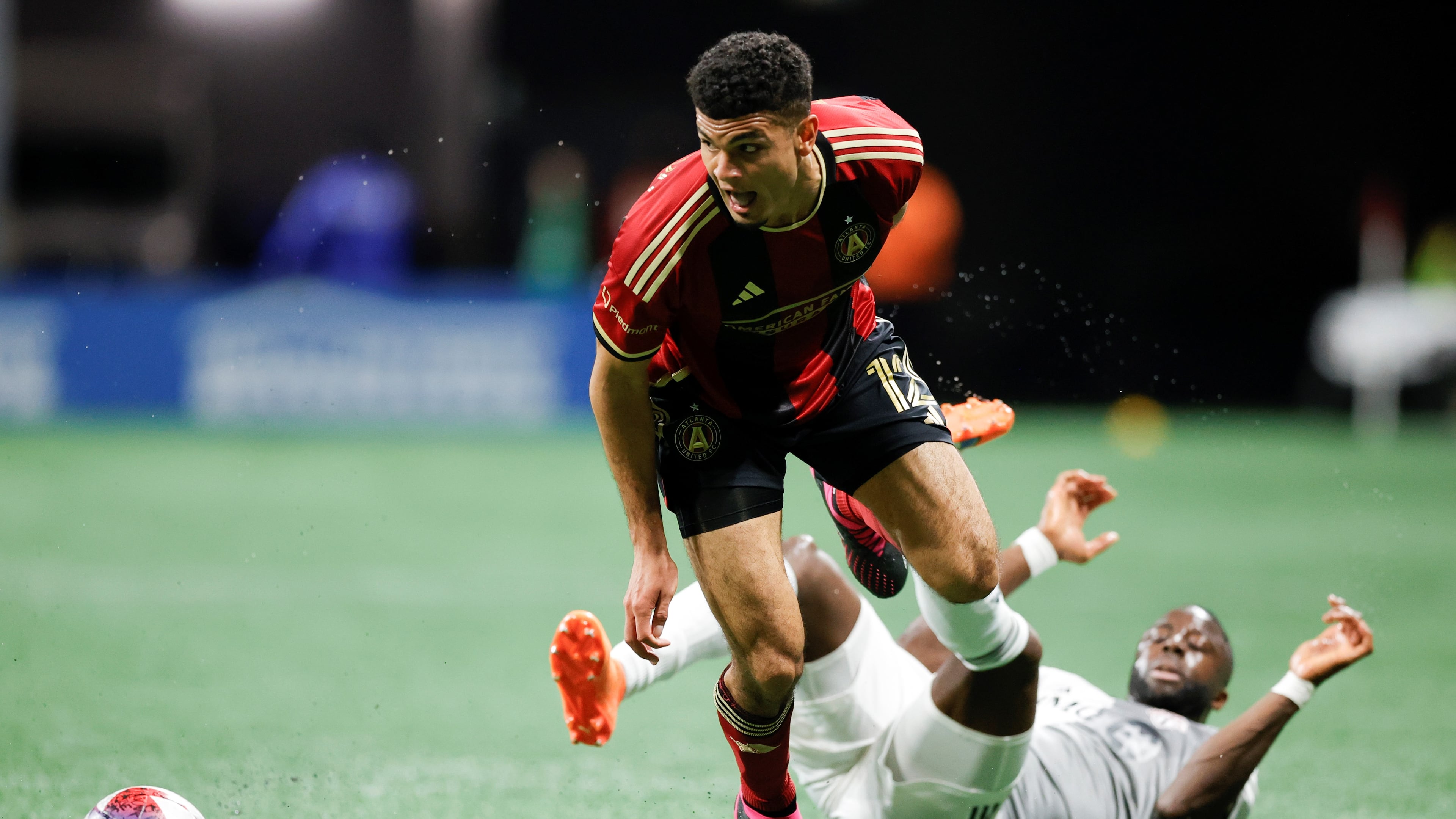 Atlanta United defender Miles Robinson fields the ball past Toronto forward Adama Diomandé during the first half of an MLS match March 4 in Atlanta.
