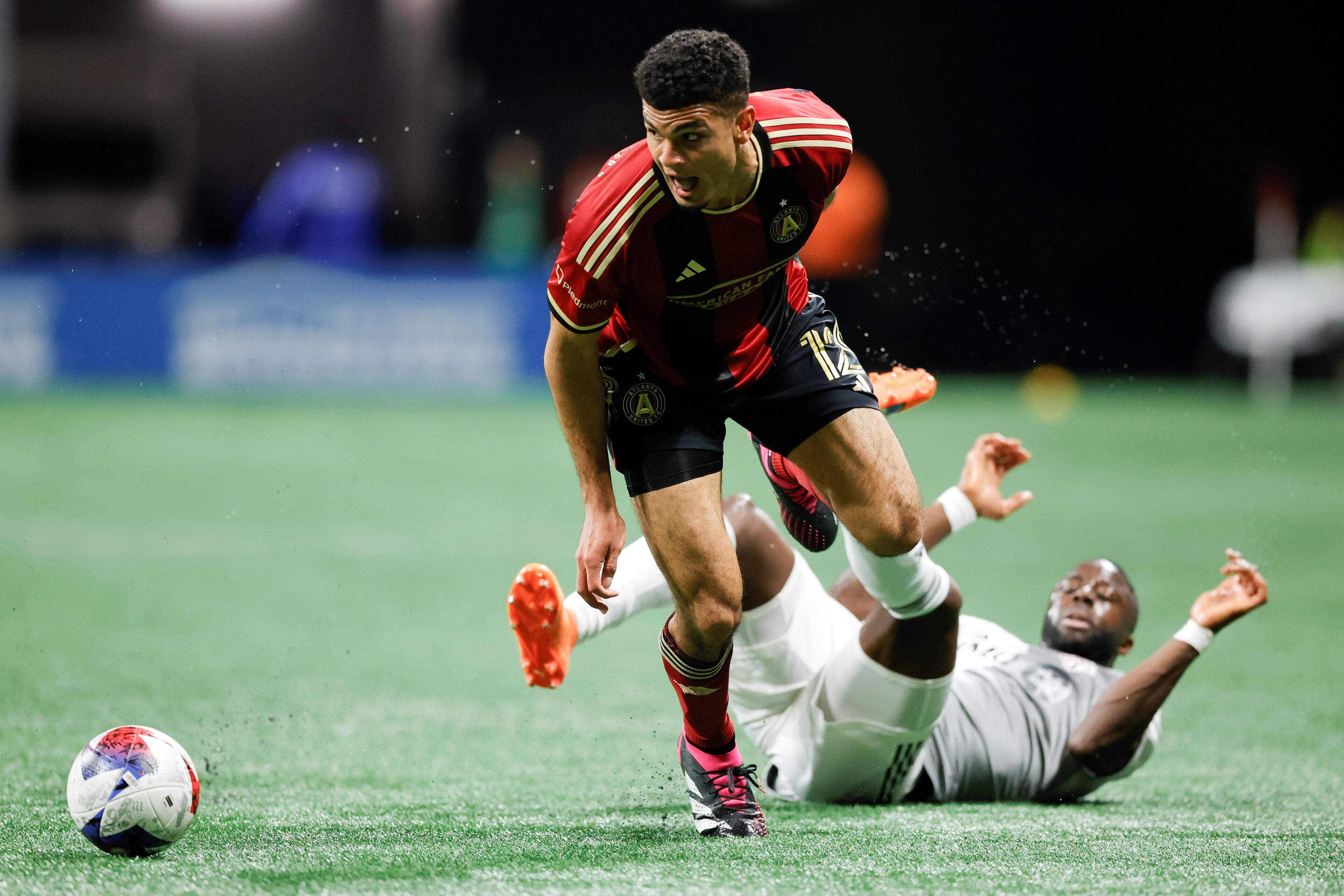 Atlanta United defender Miles Robinson fields the ball past Toronto FC forward Adama Diomandé during the first half of an MLS soccer match, Saturday, March 4, 2023, in Atlanta.