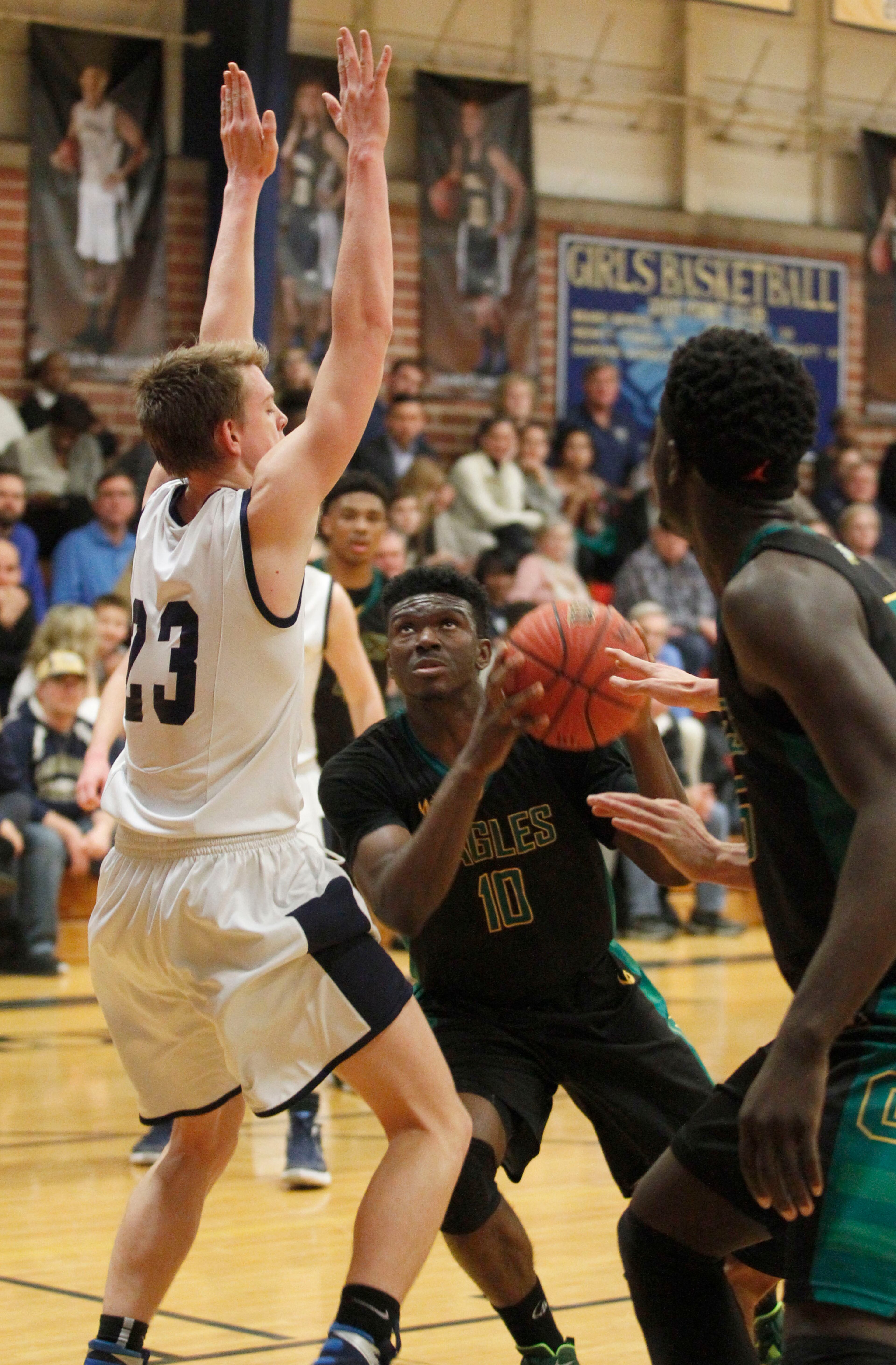 Greenforest Christian guard John Ogwuche (10) drives against Landmark Christian Wix Patton (23) at a high school basketball game at Landmark Christian school Friday, February 5, 2016. TAMI CHAPPELL/SPECIAL TO THE AJC