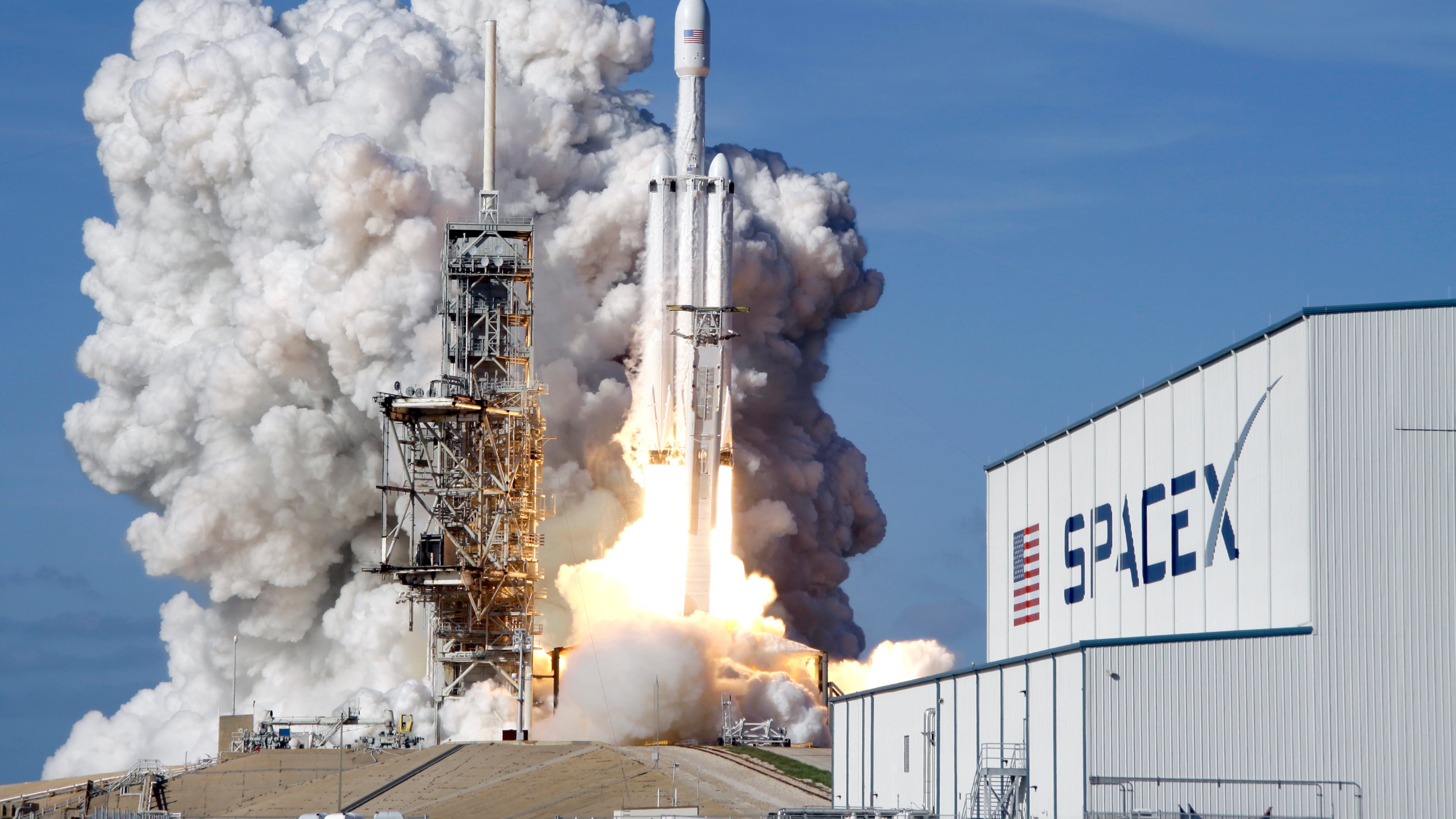 FILE - A Falcon 9 SpaceX heavy rocket lifts off from pad 39A at the Kennedy Space Center in Cape Canaveral, Fla., Tuesday, Feb. 6, 2018. (AP Photo/John Raoux, File)