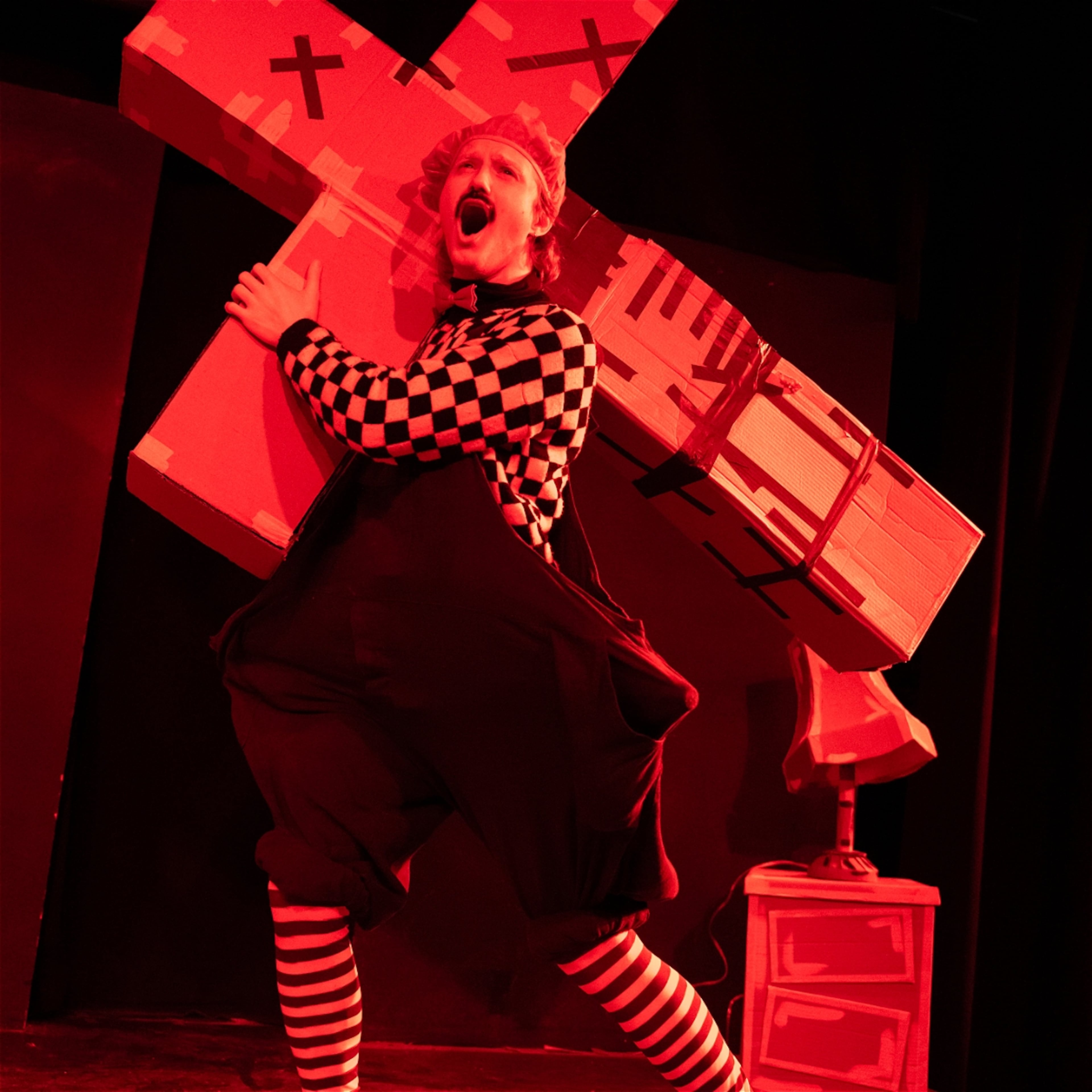 Mr. Cardboard (Miles Calderon) has his own cross to bear in the solo show "The Passion of Mr. Cardboard." (Courtesy of Finn Piper)