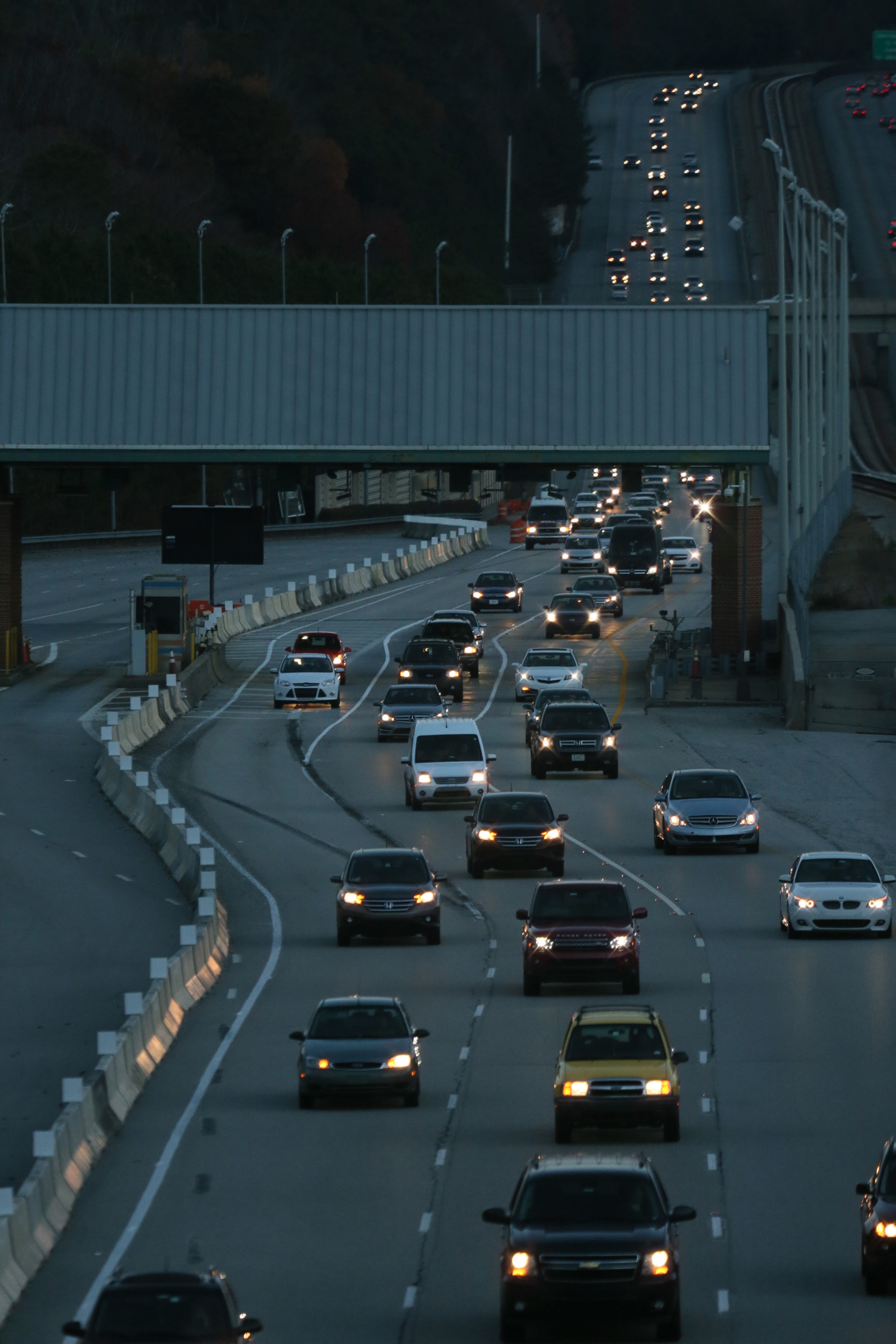 The scene at morning rush hour at the Ga 400 tolls. The tolls were closed on Friday after 20 years. Demolition of the toll will begin in January. Drivers can now use three lanes in each direction for free. However, the speed limit will be reduced to 45 mph through the construction zone while the work is in progress, and traffic will be rerouted through the Cruise Card lanes. BOB ANDRES/BANDRES@AJC.COM