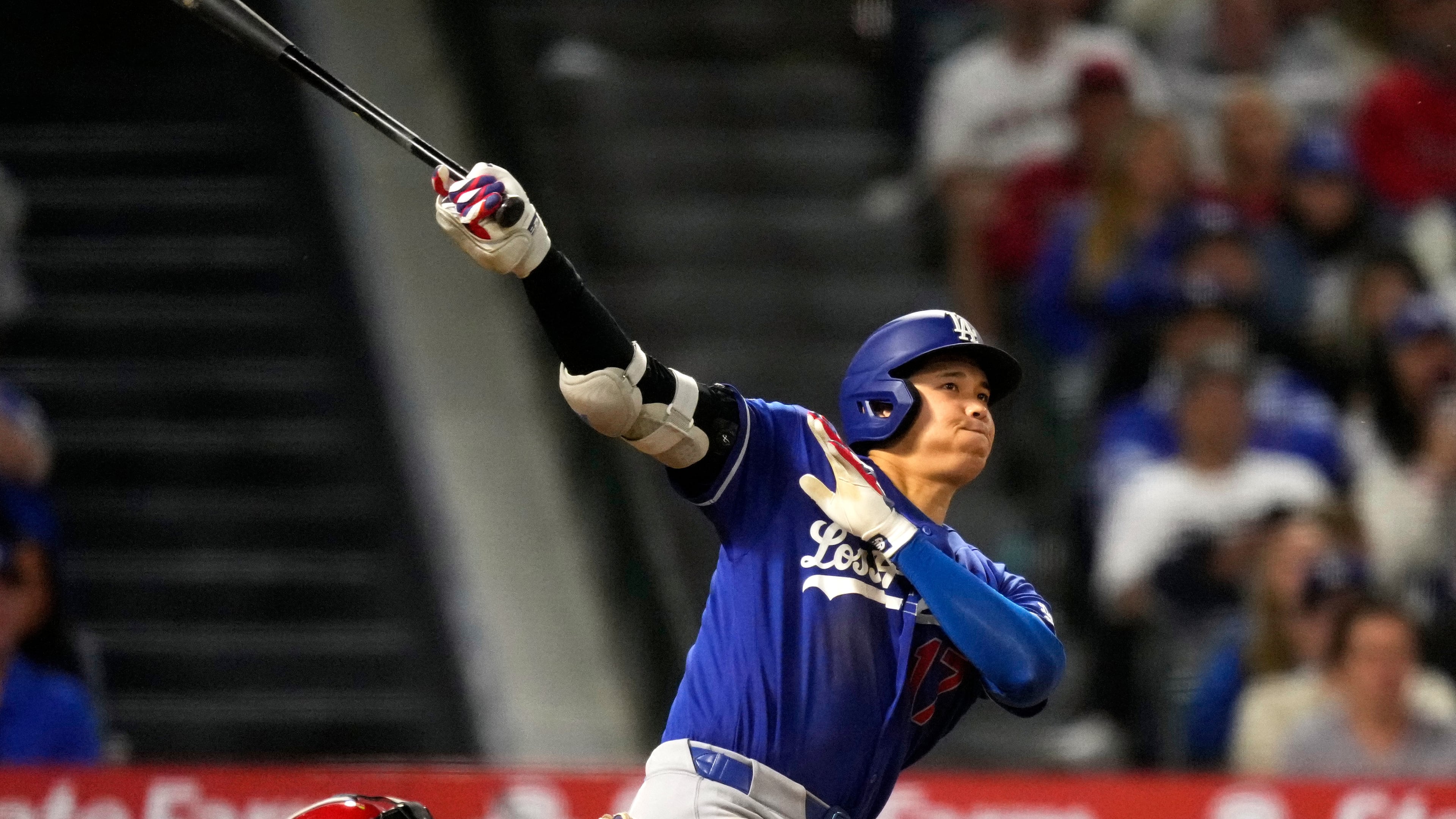Los Angeles Dodgers' Shohei Ohtani hits a two-run triple during the eighth inning of a baseball game against the Los Angeles Angels, Saturday, May 16, 2026, in Anaheim, Calif. (AP Photo/Mark J. Terrill) CORRECTION: After official review, changed from three-run inside-the-park home run to two-run triple after a throwing error