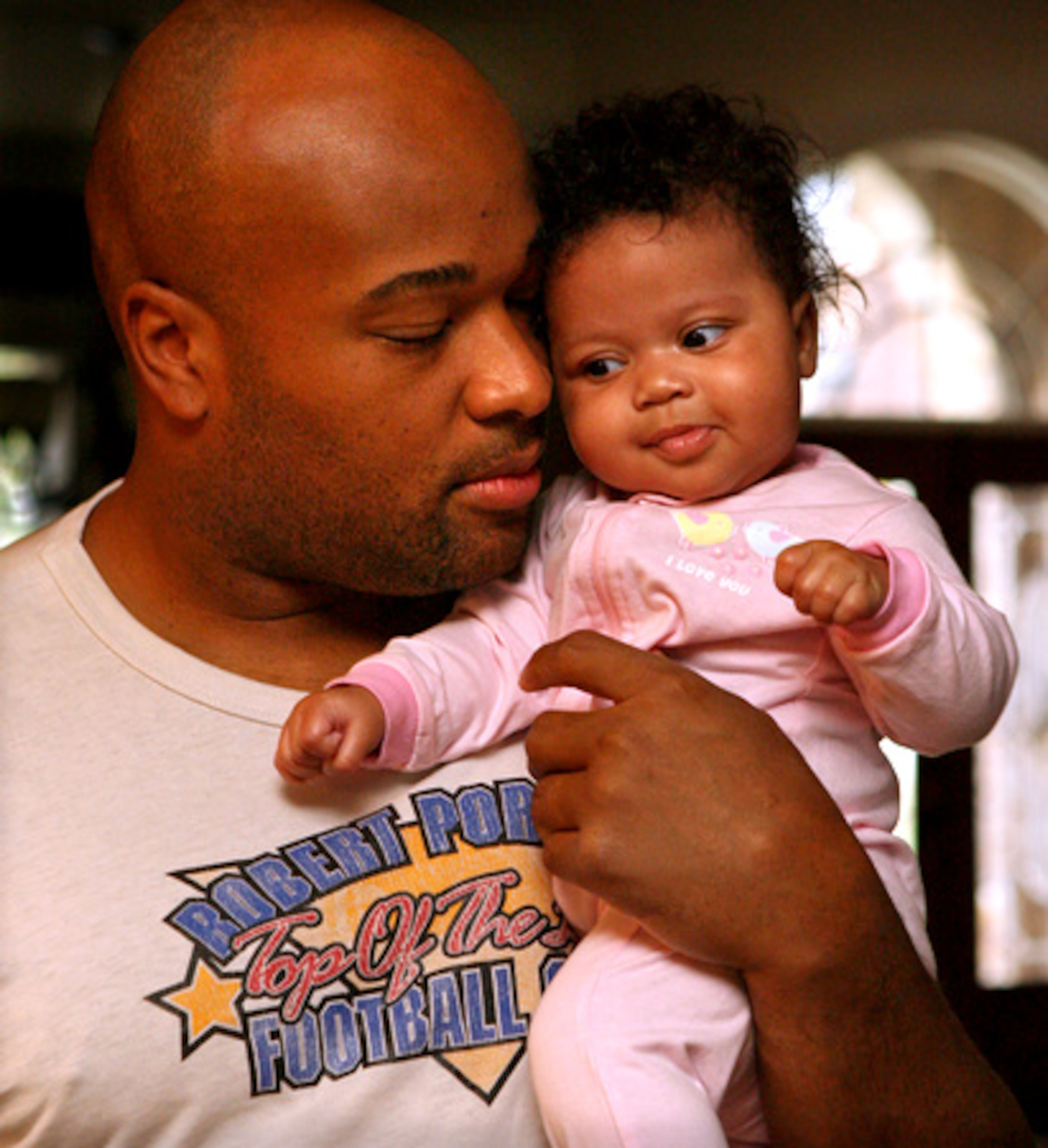 Father and daughter enjoy a little cuddling time.