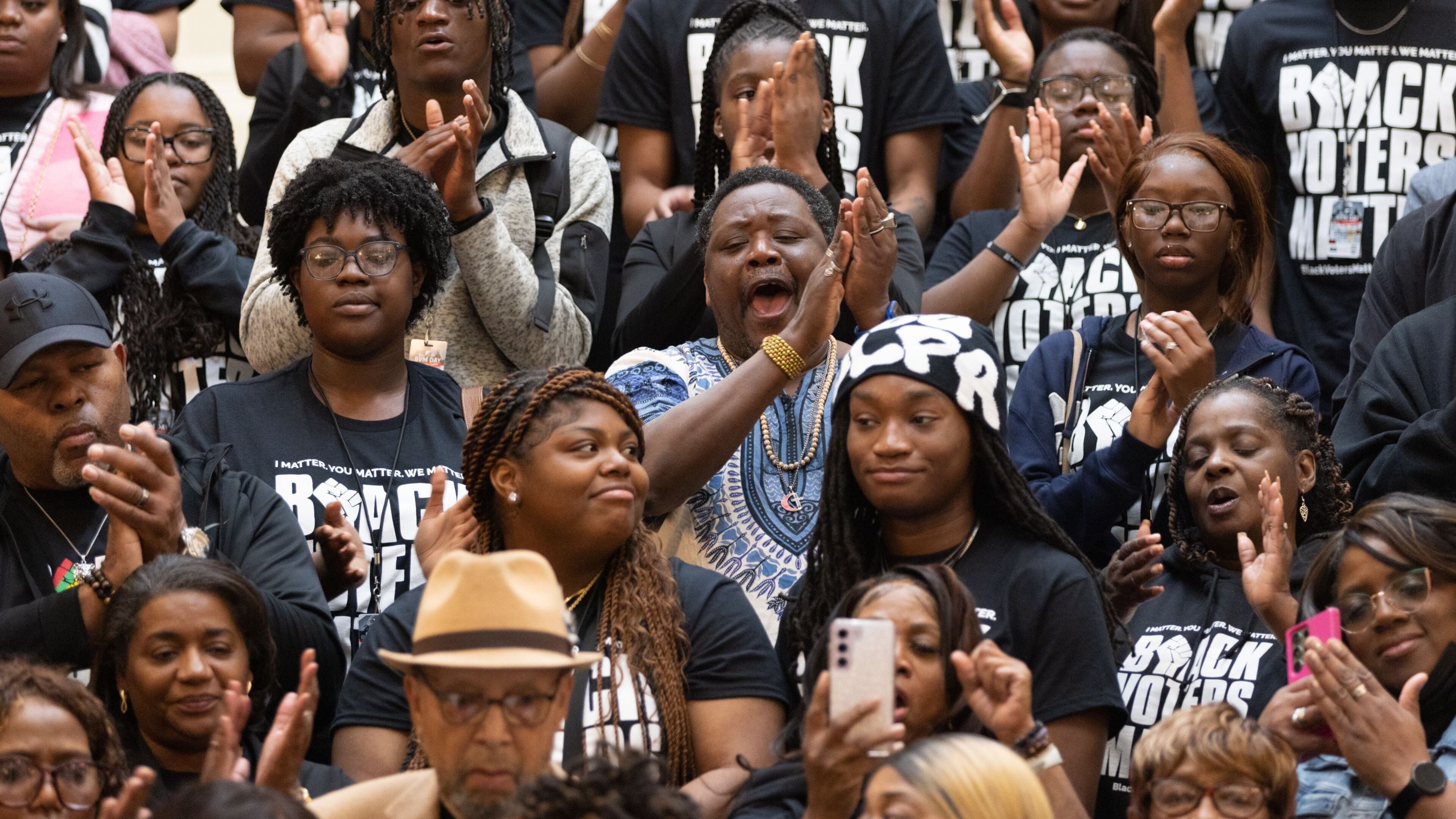 Black Voters Matter activists applaud at a press conference at the Capitol in Atlanta on Wednesday, Feb. 28, 2024. (Arvin Temkar/The Atlanta Journal-Constitution/TNS)