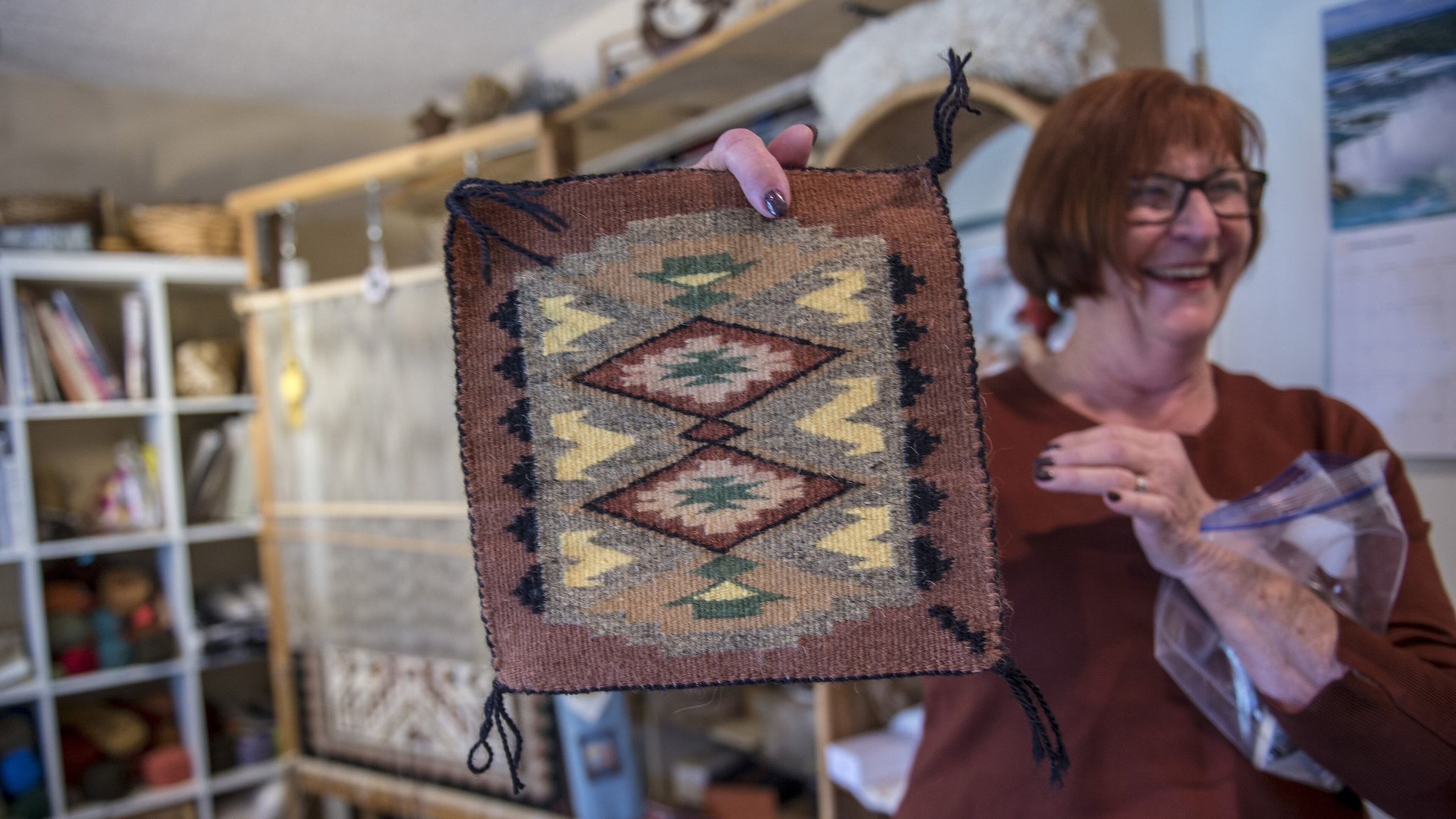 Marilyn Greaves is one of California’s top Navajo-style weavers and her home is filled with her art work like this one she is holding and that of work she has collected in Fair Oaks, Calif., on Wednesday, Jan. 31, 2018. (Tenee C. Byer/Sacramento Bee/TNS)