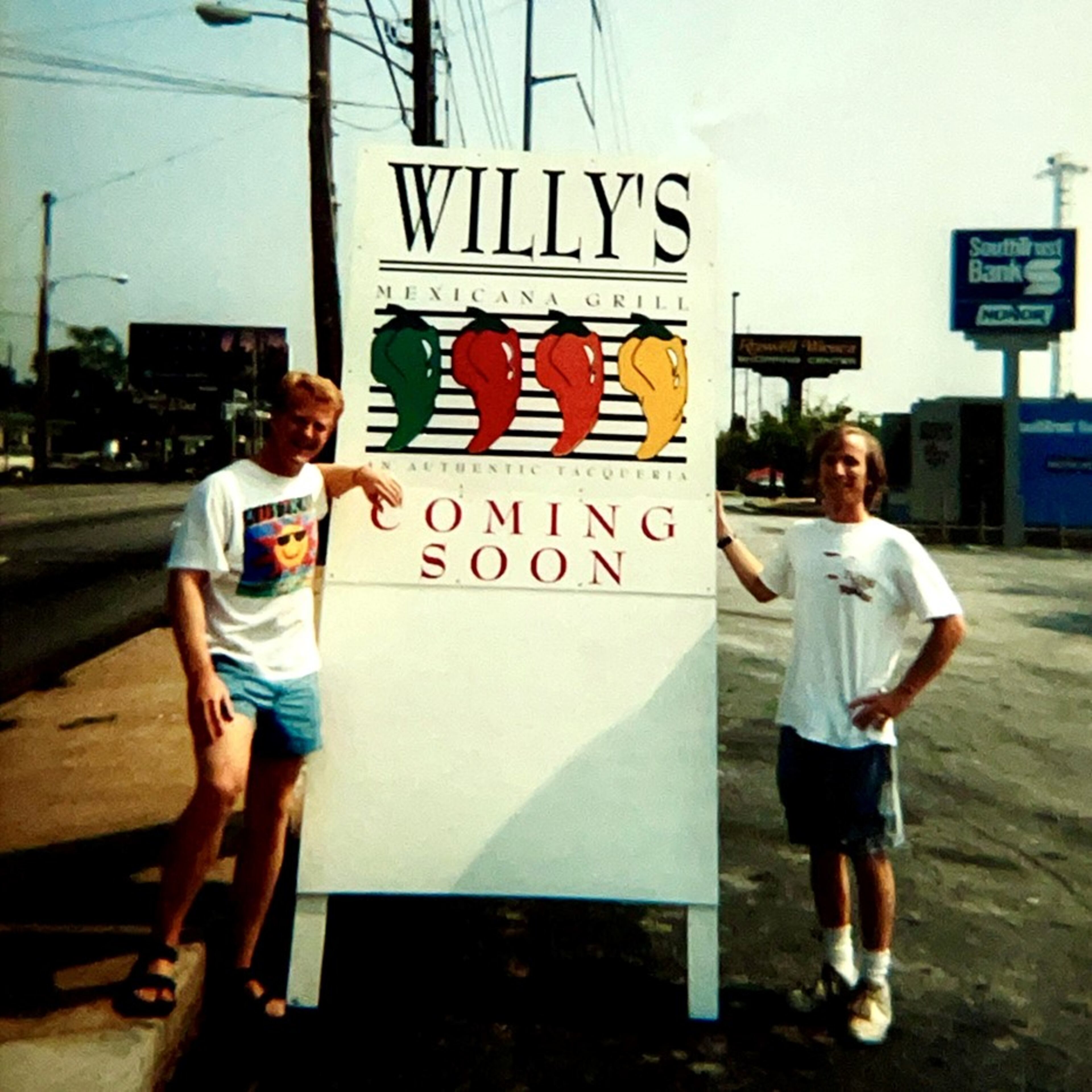 Willy Bitter poses with the first "coming soon" sign for Willy's Mexicana Grill in 1995. (Courtesy of Willy's Mexicana Grill)