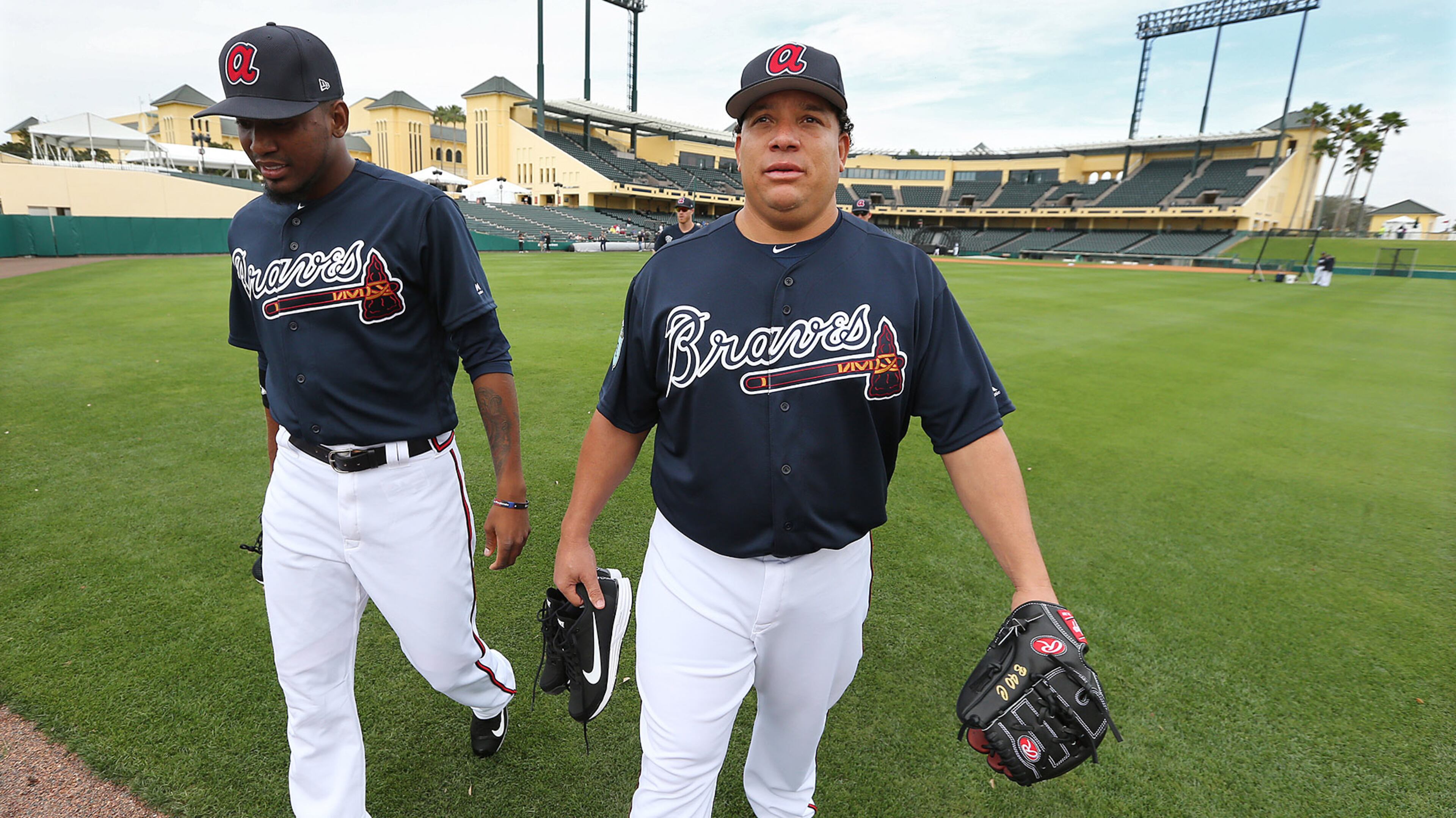 February 15, 2017, Lake Buena Vista, FL: Braves pitchers Julio Teheran and Bartolo Colon take the field at Champion Stadium as Braves pitchers and catchers hold their first workout on Wednesday Feb. 15, 2017, at the ESPN Wide World of Sports in Lake Buena Vista. Curtis Compton/ccompton@ajc.com