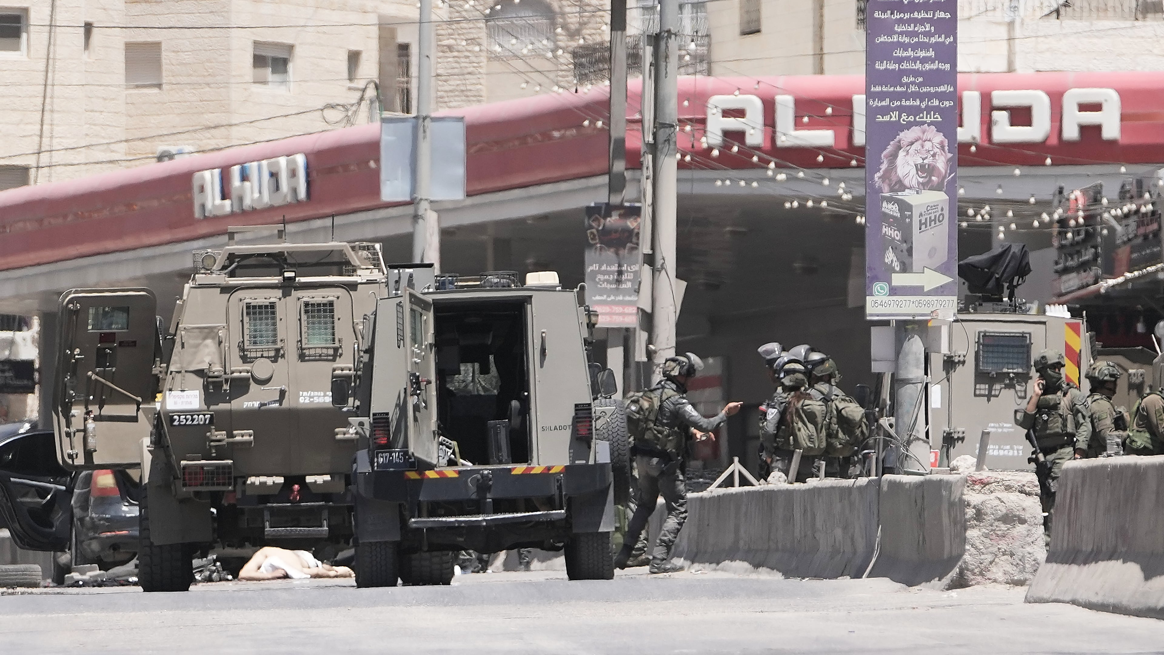 Israeli border police officers operate in the West Bank refugee camp of Qalandia, after Israeli forces shot and killed a suspected militant who opened fire on troops Monday, May 11, 2026. (AP Photo/Mahmoud Illean)