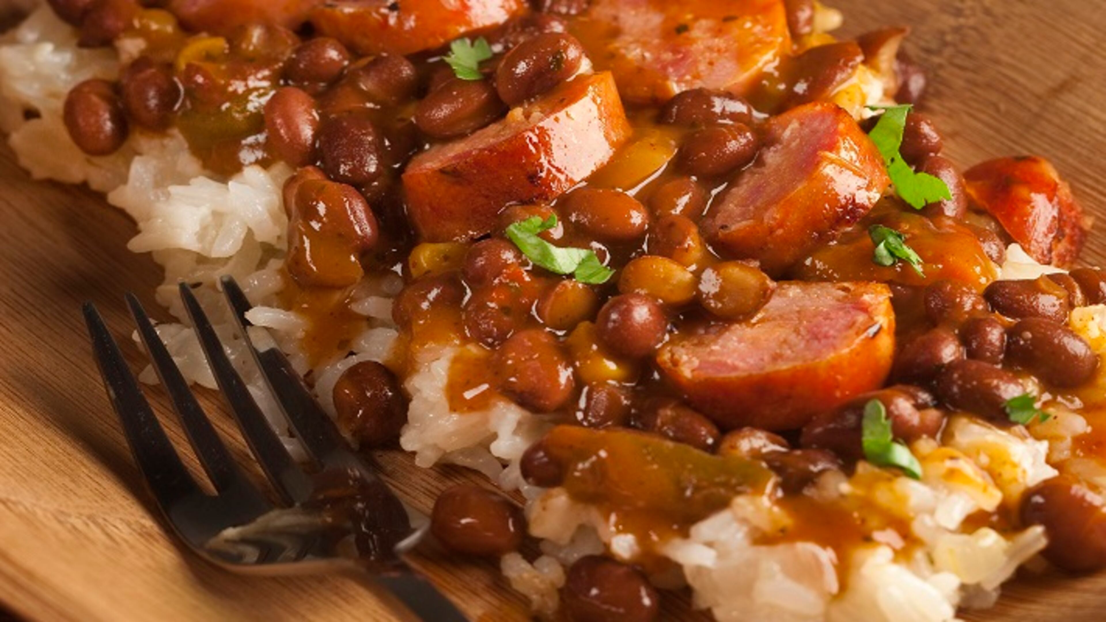 A dish of beans and rice, augmented with andouille sausage, needs wines that cut through or match the big flavors. (Bill Hogan/Chicago Tribune/TNS)