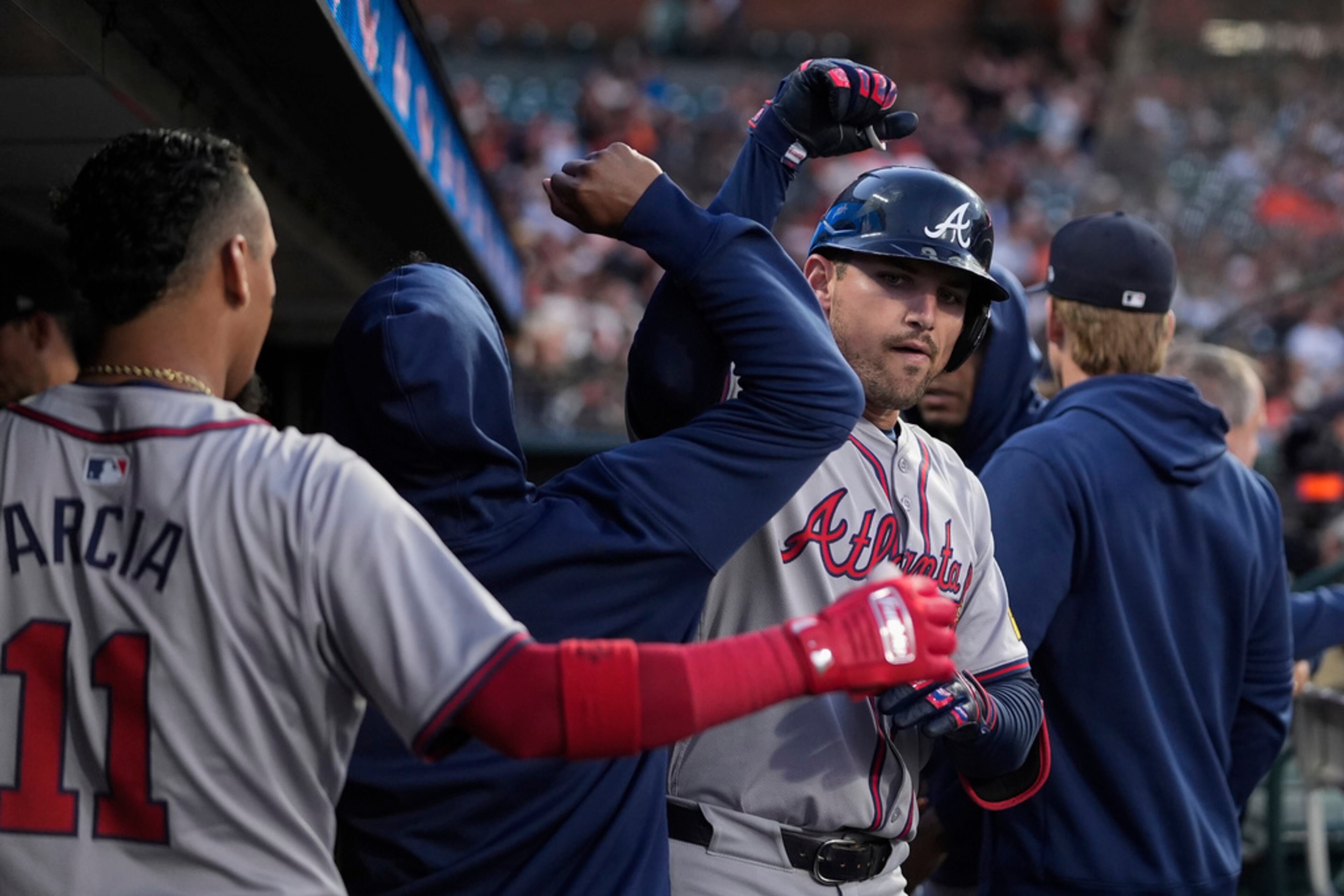 Atlanta Braves' Austin Riley, right, celebrates with teammates in the dugout after hitting a solo home run against the San Francisco Giants during the fifth inning of a baseball game Wednesday, Aug. 14, 2024, in San Francisco. (AP Photo/Godofredo A. Vásquez)