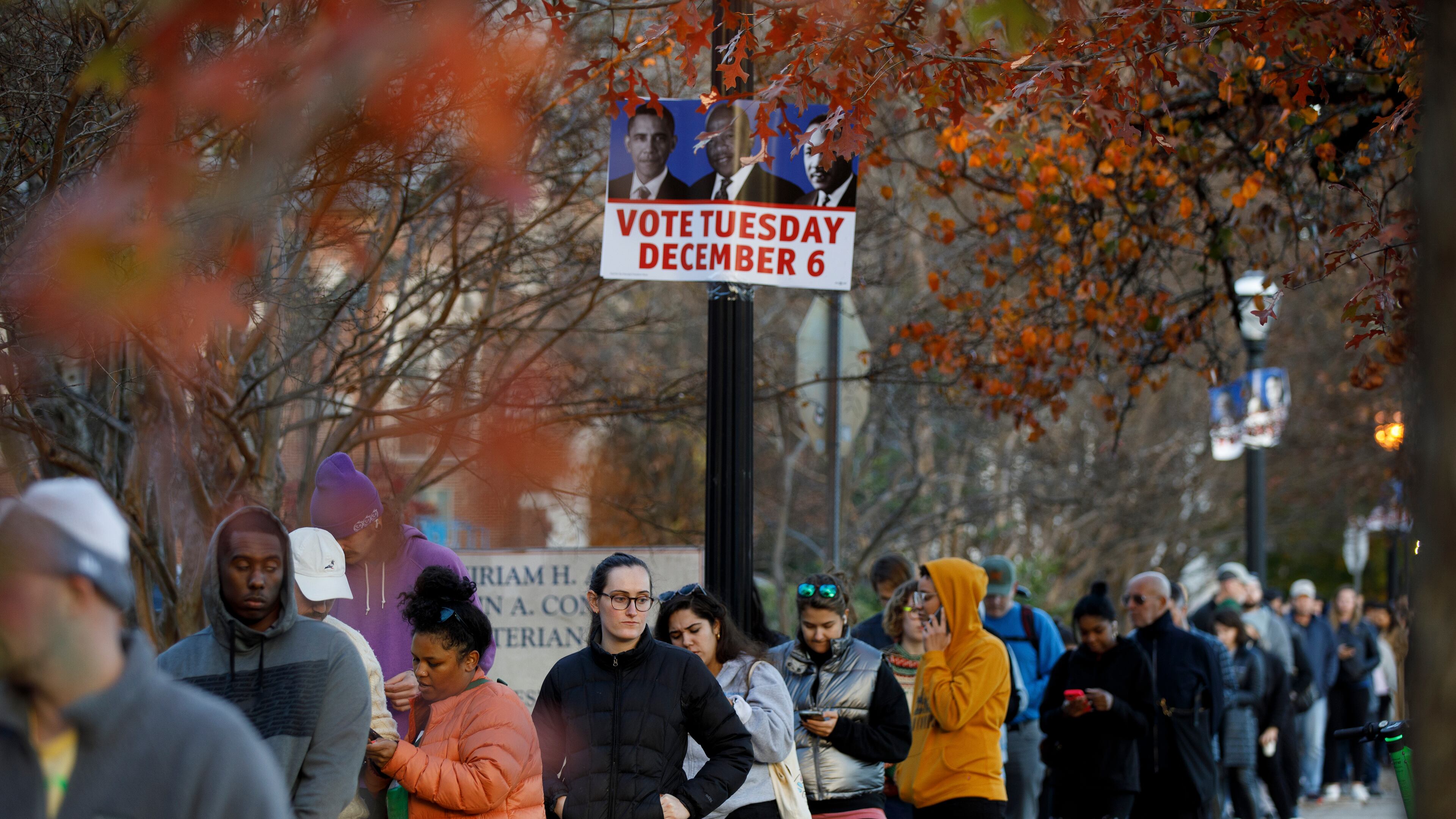 Georgia voters wait to cast their ballots outside a polling location at Ponce De Leon Library in Atlanta on Dec. 2, 2022, in the contest between the incumbent Sen. Raphael Warnock (D-Ga.) and Republican Herschel Walker. (Dustin Chambers/The New York Times)