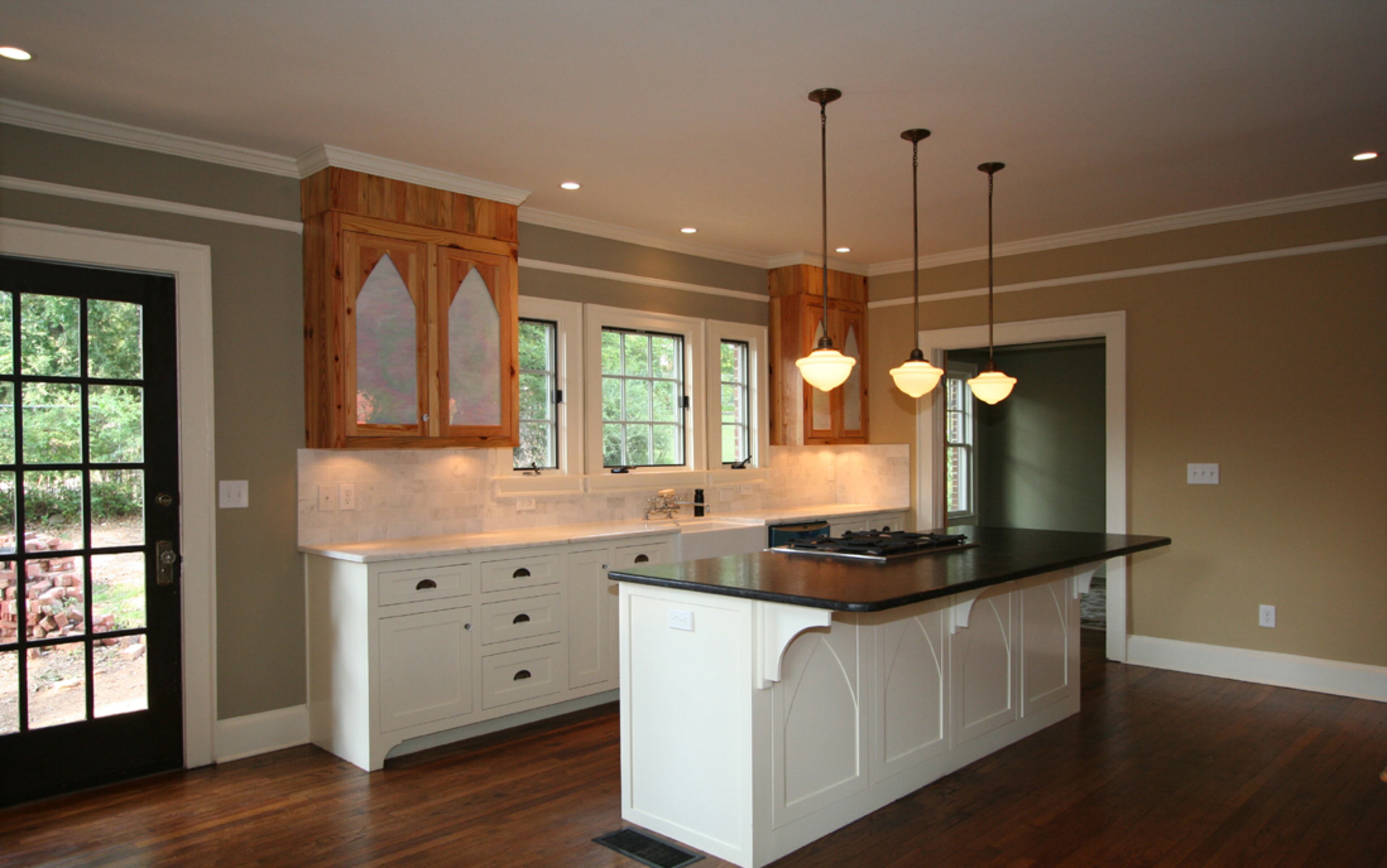 The counters in this chef's kitchen are topped with traditional Calacatta gold marble. The island is topped with St. Sebastian antique granite with a texture similar to that of leather.