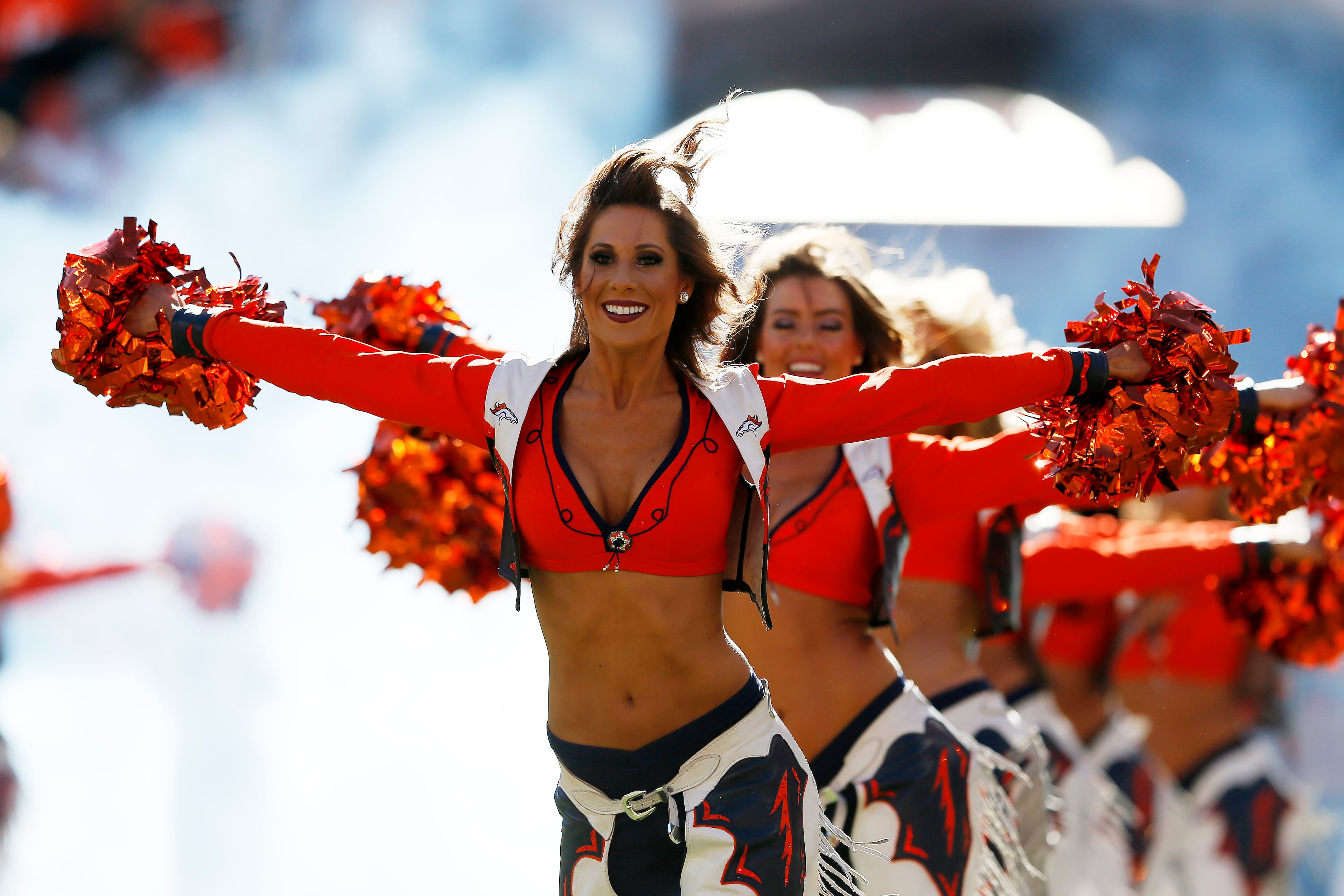 Denver Broncos cheerleaders perform prior to the AFC Championship game between the Denver Broncos and the New England Patriots at Sports Authority Field at Mile High on Jan. 19, 2014, in Denver, Colo.
