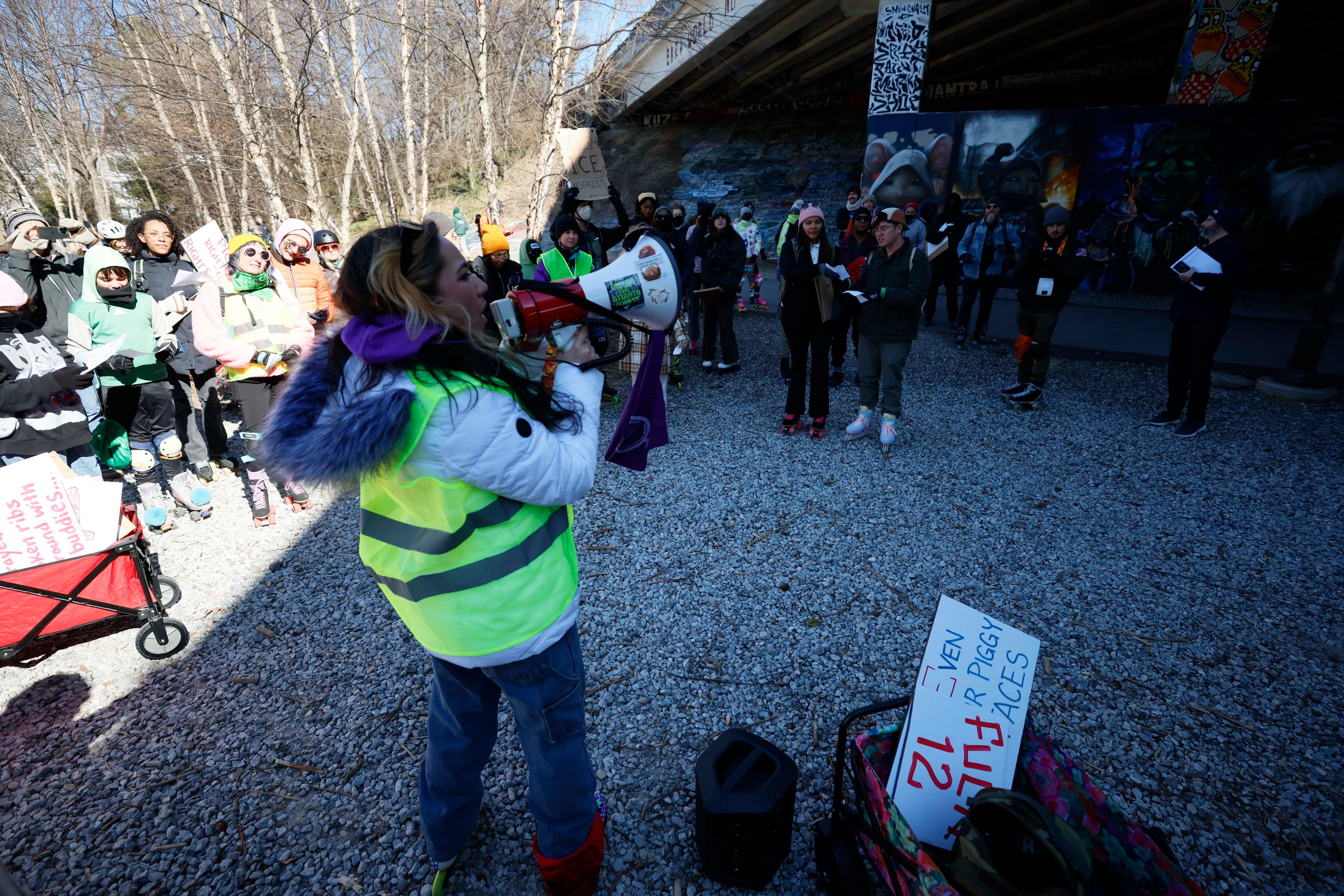 Community organizer Samantha Hamilton speaks to participants at a "Skaters Against ICE and War" rally along the Atlanta Beltline on Sunday, Feb. 1, 2026, in Atlanta. (Miguel Martinez/AJC)