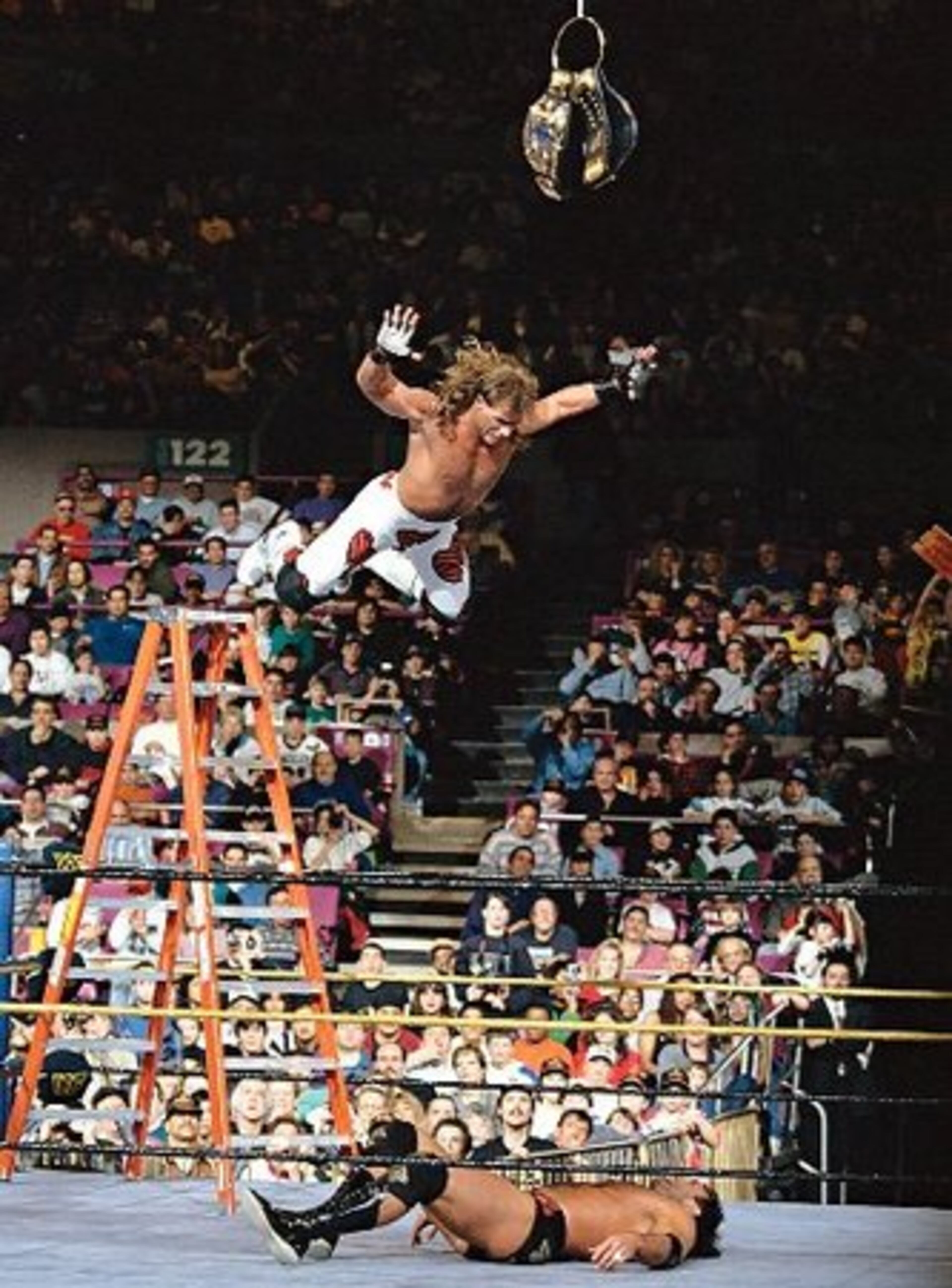 1994: Shawn Michaels prepares to splash Razor Ramon in a ladder match at WrestleMania X on March 20 at Madison Square Garden in New York.