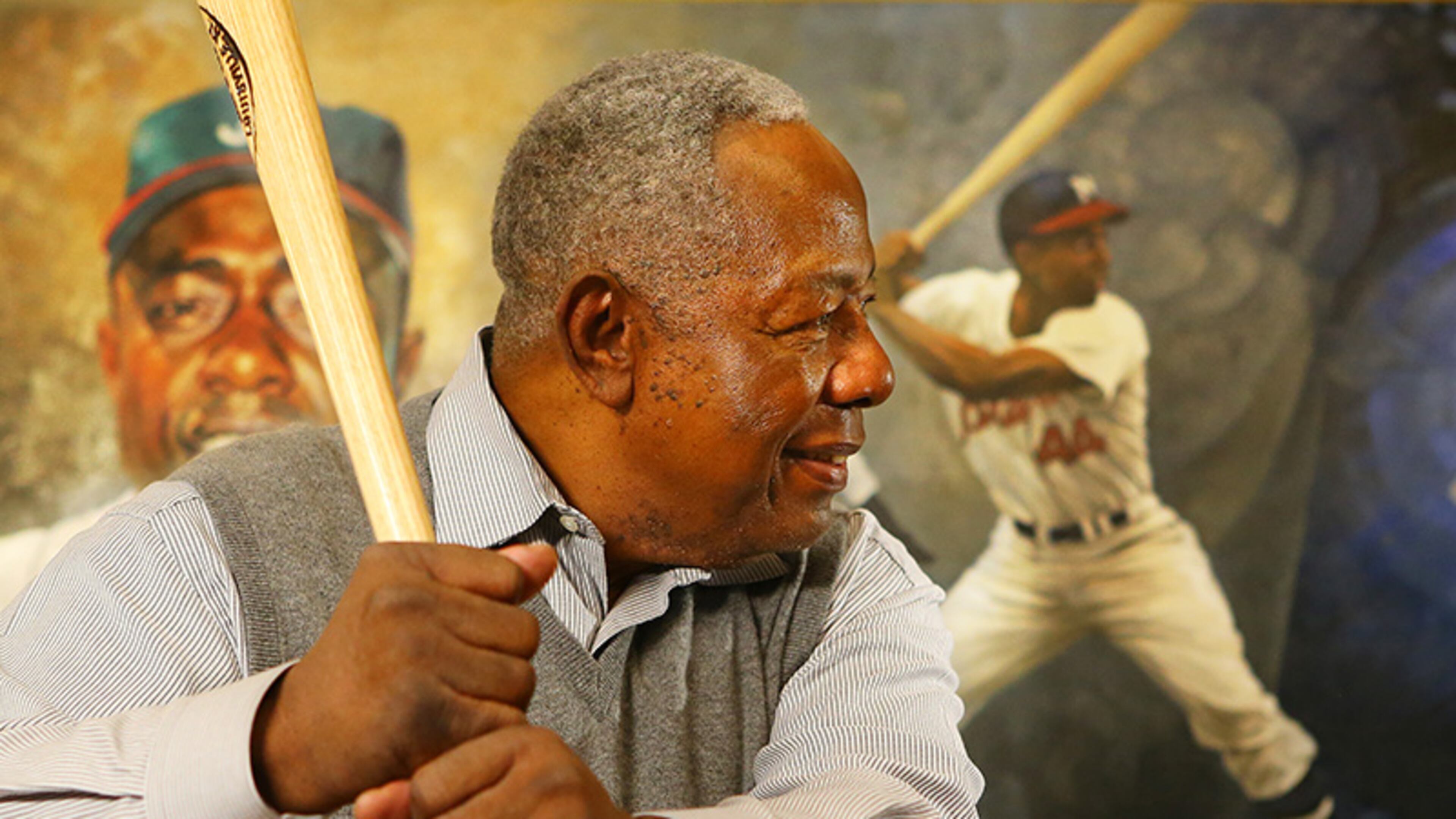 Braves legend Hank Aaron shows he still has his form from his four decades as a slugger.