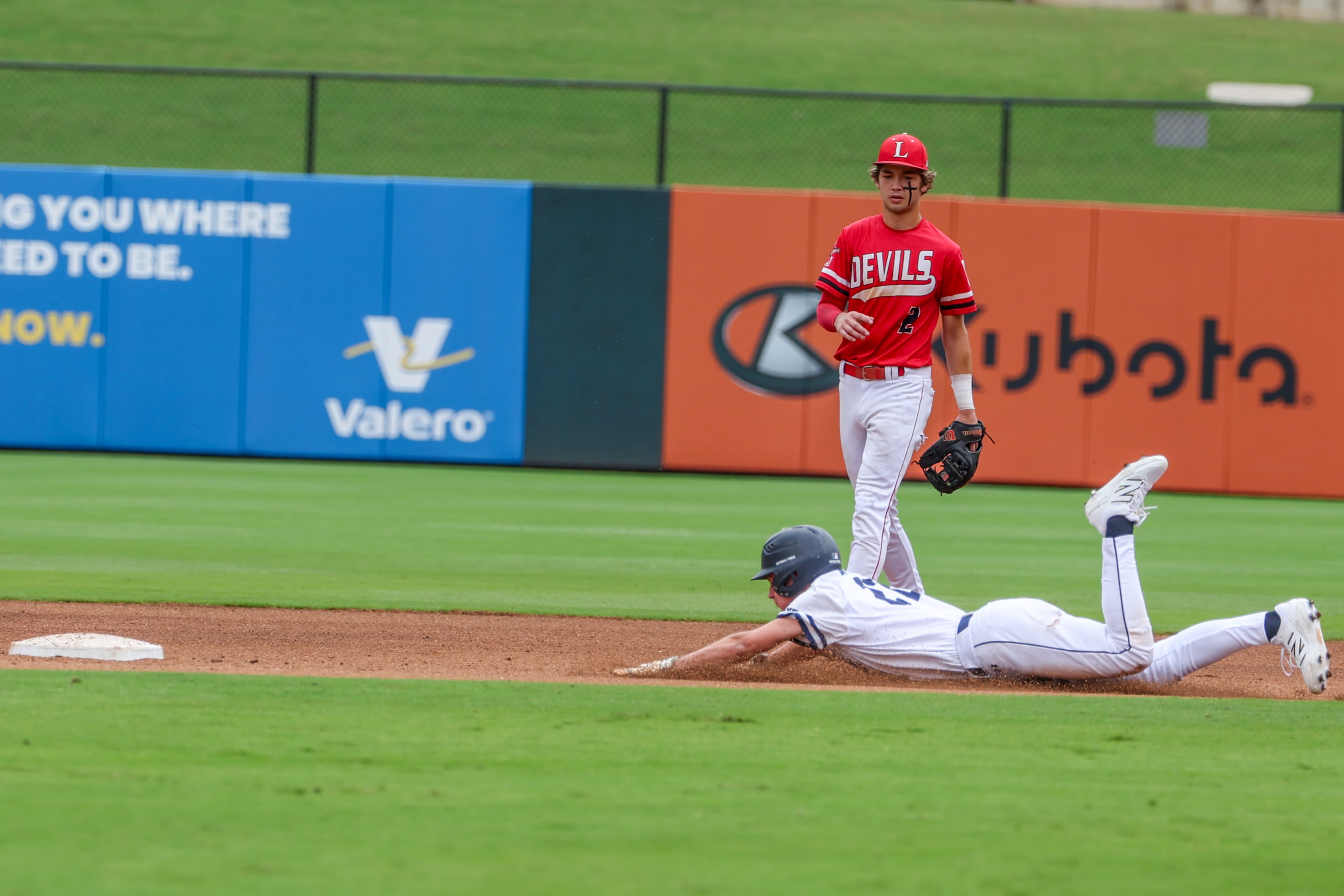 Pope’s Brayden Slorahn slides to second during Game 2 of their GHSA Class 5A baseball championship series against Loganville at Gwinnett Field on Tuesday, May 26, 2026, in Lawrenceville. (Arvin Temkar/AJC)