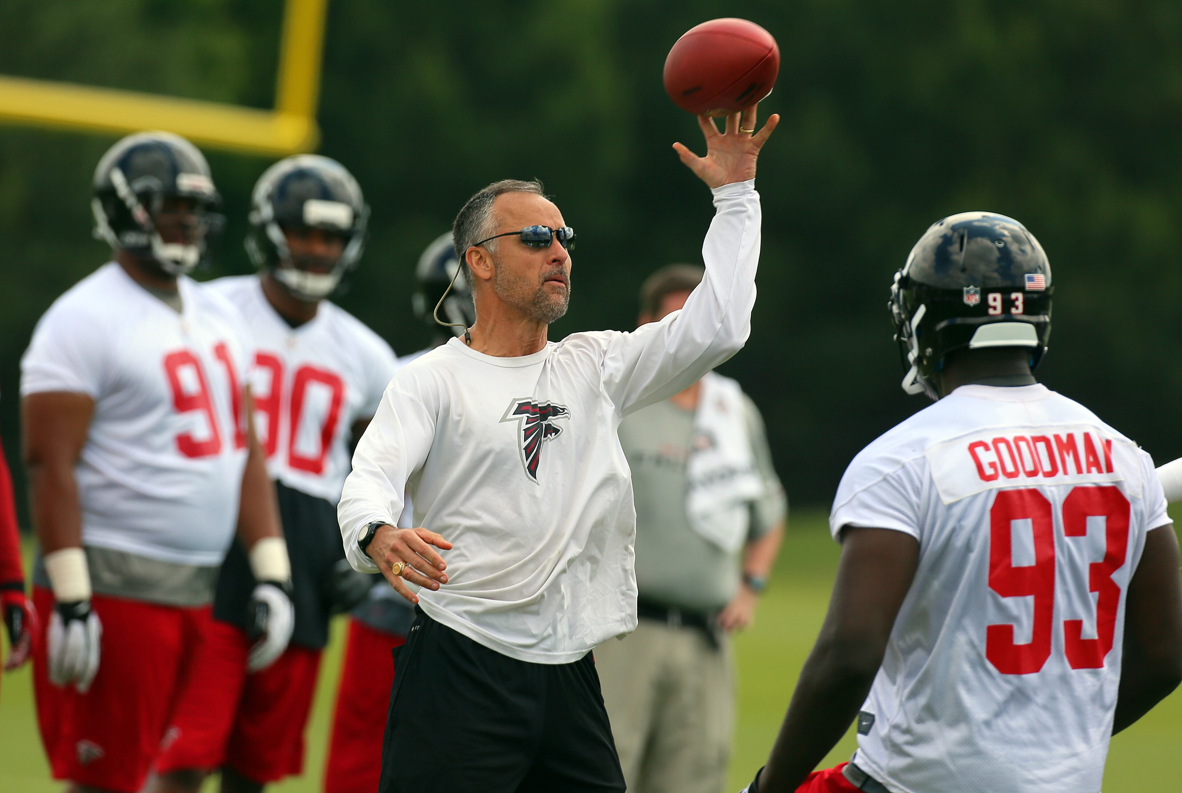 Defensive coordinator Mike Nolan leads the Falcons defense through drills. CURTIS COMPTON / CCOMPTON@AJC.COM