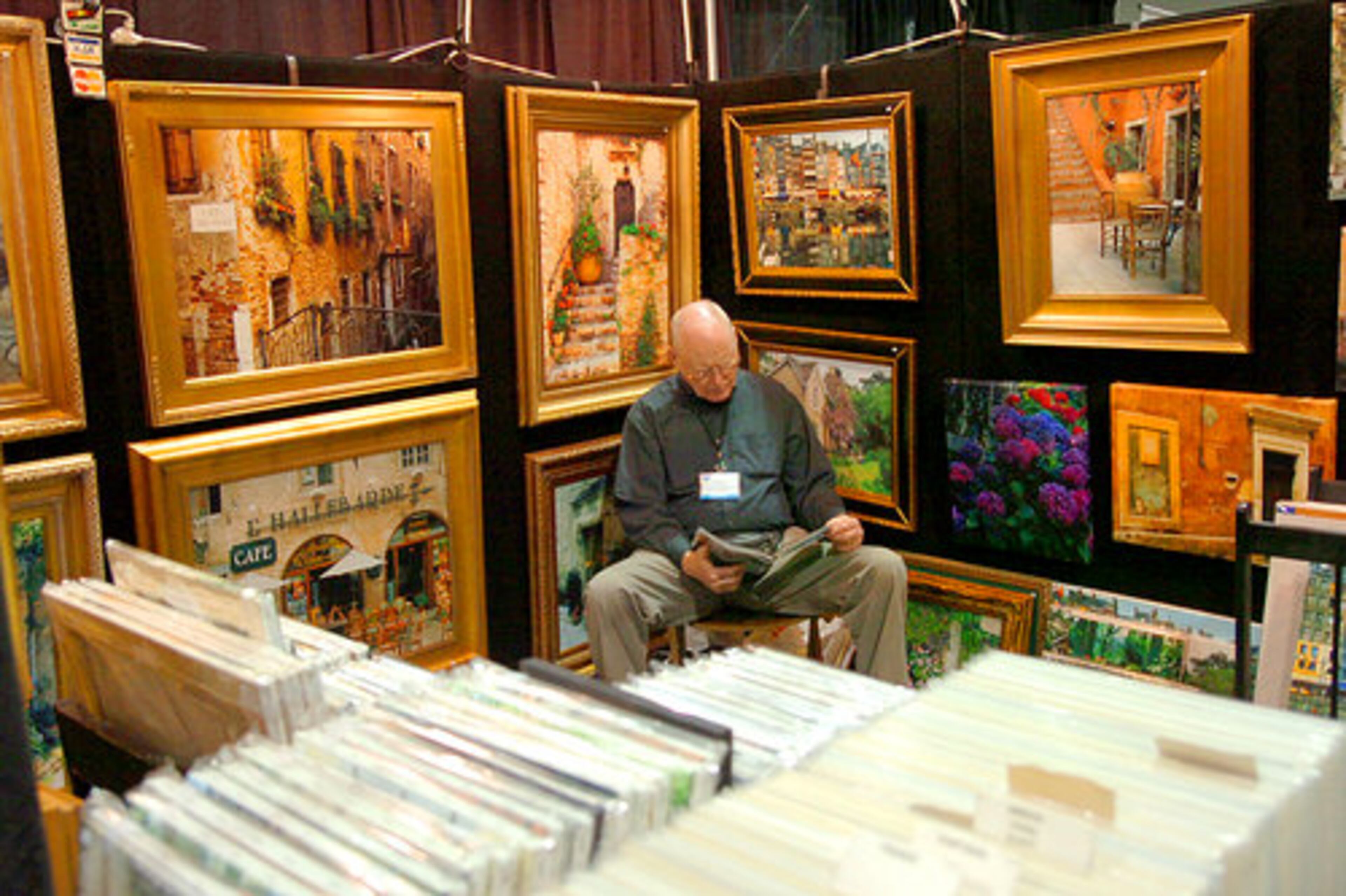 Travel photographer Joe Don Willis, from Covington, is surrounded by his artwork.