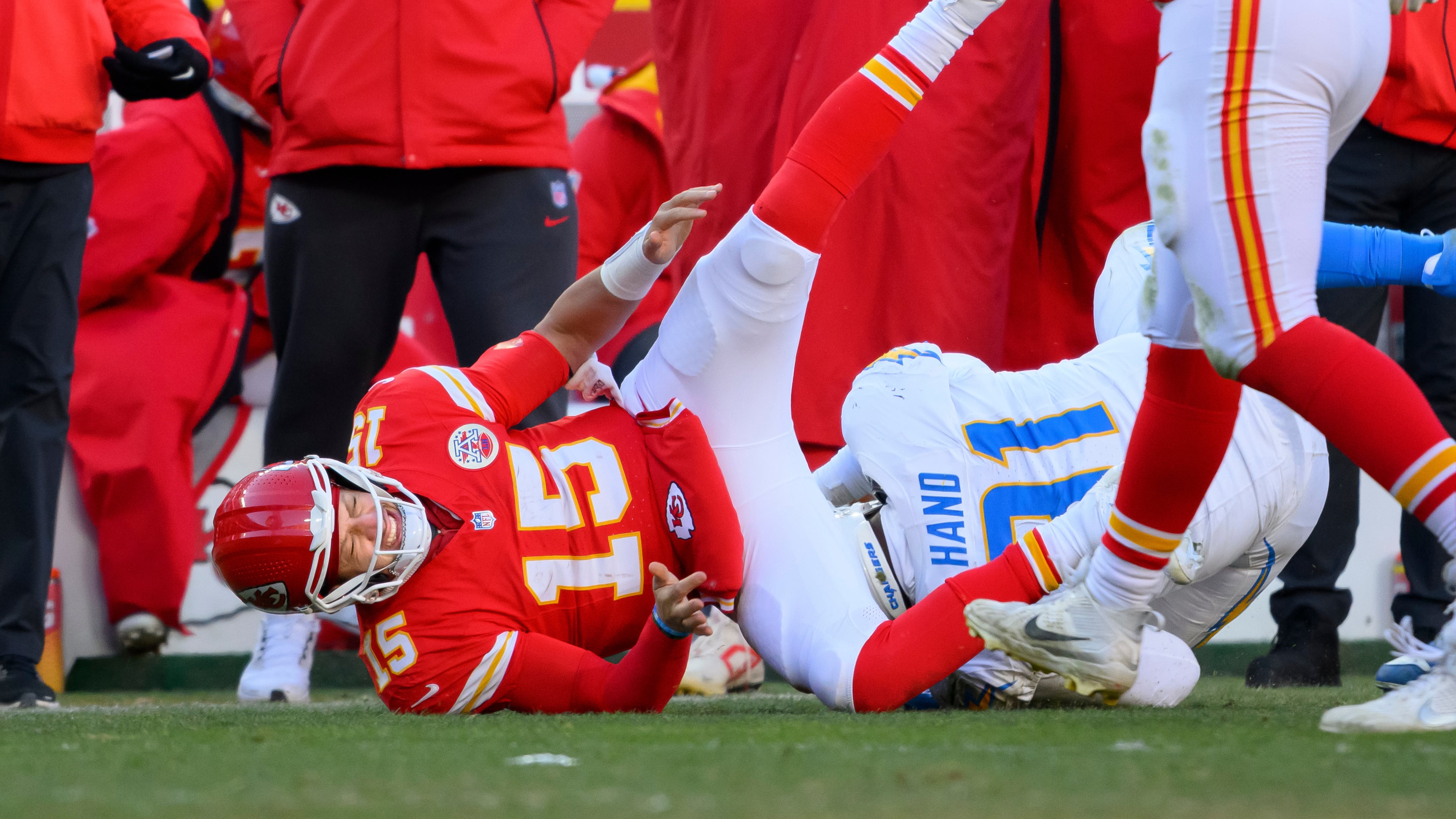 FILE - Kansas City Chiefs quarterback Patrick Mahomes (15) is injured while being tackled by Los Angeles Chargers defensive tackle Da'Shawn Hand (91) during the second half of an NFL football game, Dec. 14, 2025 in Kansas City, Mo. (AP Photo/Reed Hoffmann, File)