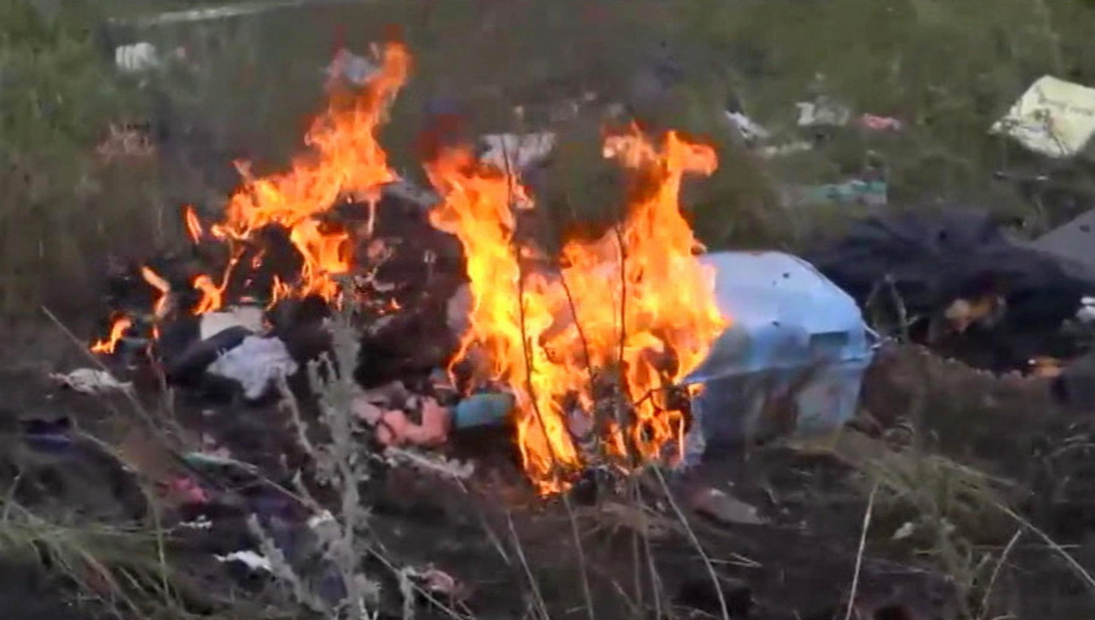 In this image taken from video, Thursday July 17, 2014, showing flames rising from part of the wreckage of a passenger plane carrying 295 people after it was shot down Thursday as it flew over Ukraine, near the village of Hrabove, in eastern Ukraine. Malaysia Airlines tweeted that it lost contact with one of its flights as it was traveling from Amsterdam to Kuala Lumpur over Ukrainian airspace. (AP Photo / Channel 1)