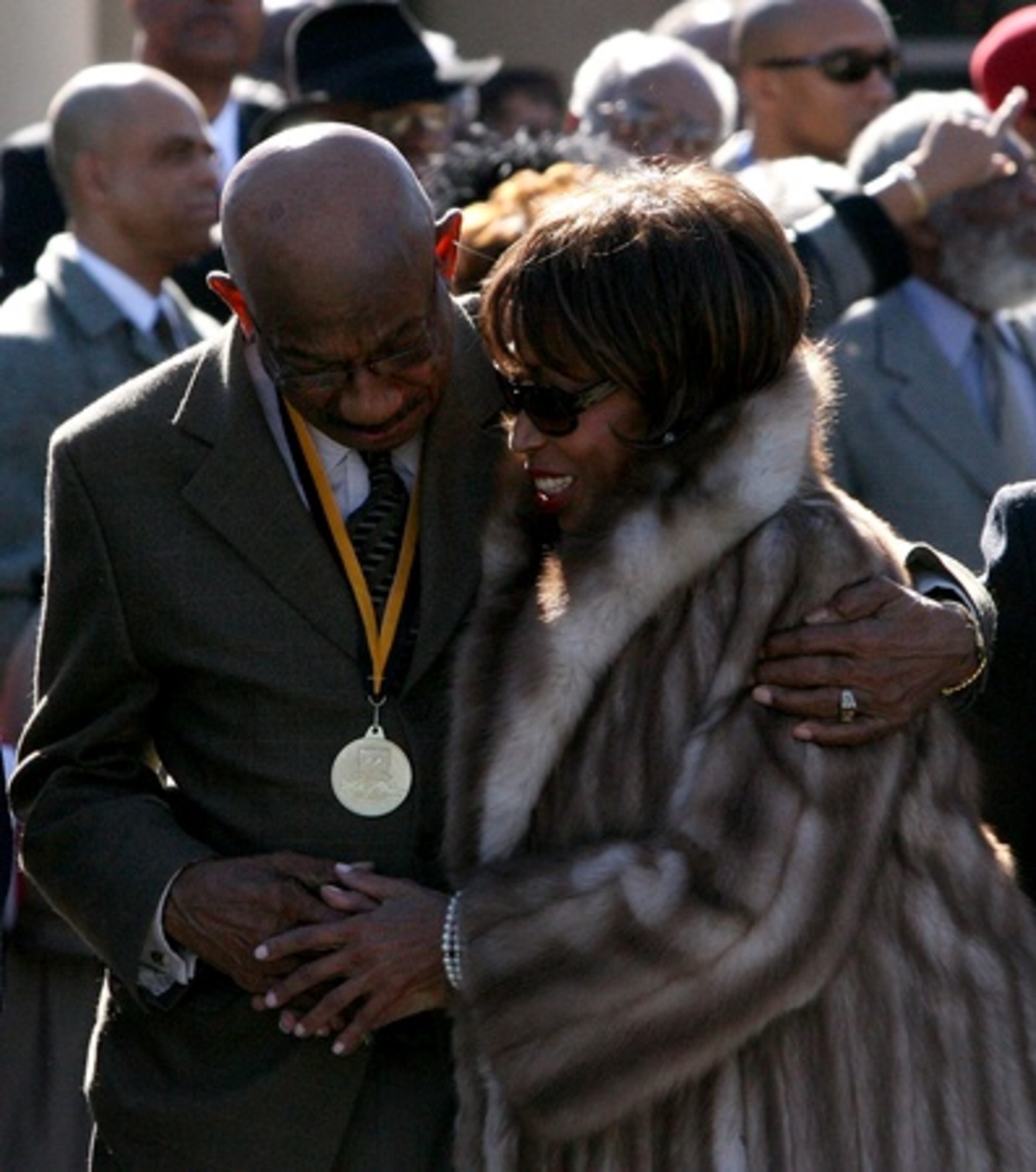 Atlanta developer Herman J. Russell hugs Altovise Davis, wife of entertainer Sammy Davis Jr., Russell and and Sammy Davis Jr., who died in 1990, now have foot prints on the Walk of Fame.
