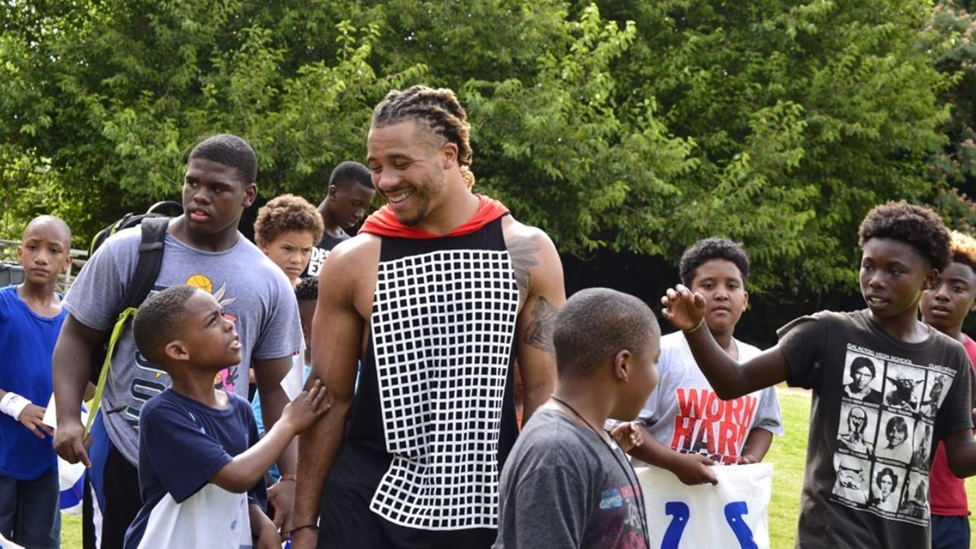 Edwin Jackson interacts with youths. Jackson, a native Atlantan, played for the Indianapolis Colts. He also started a foundation, the Edwin Jackson 53 Foundation. (Family photo)