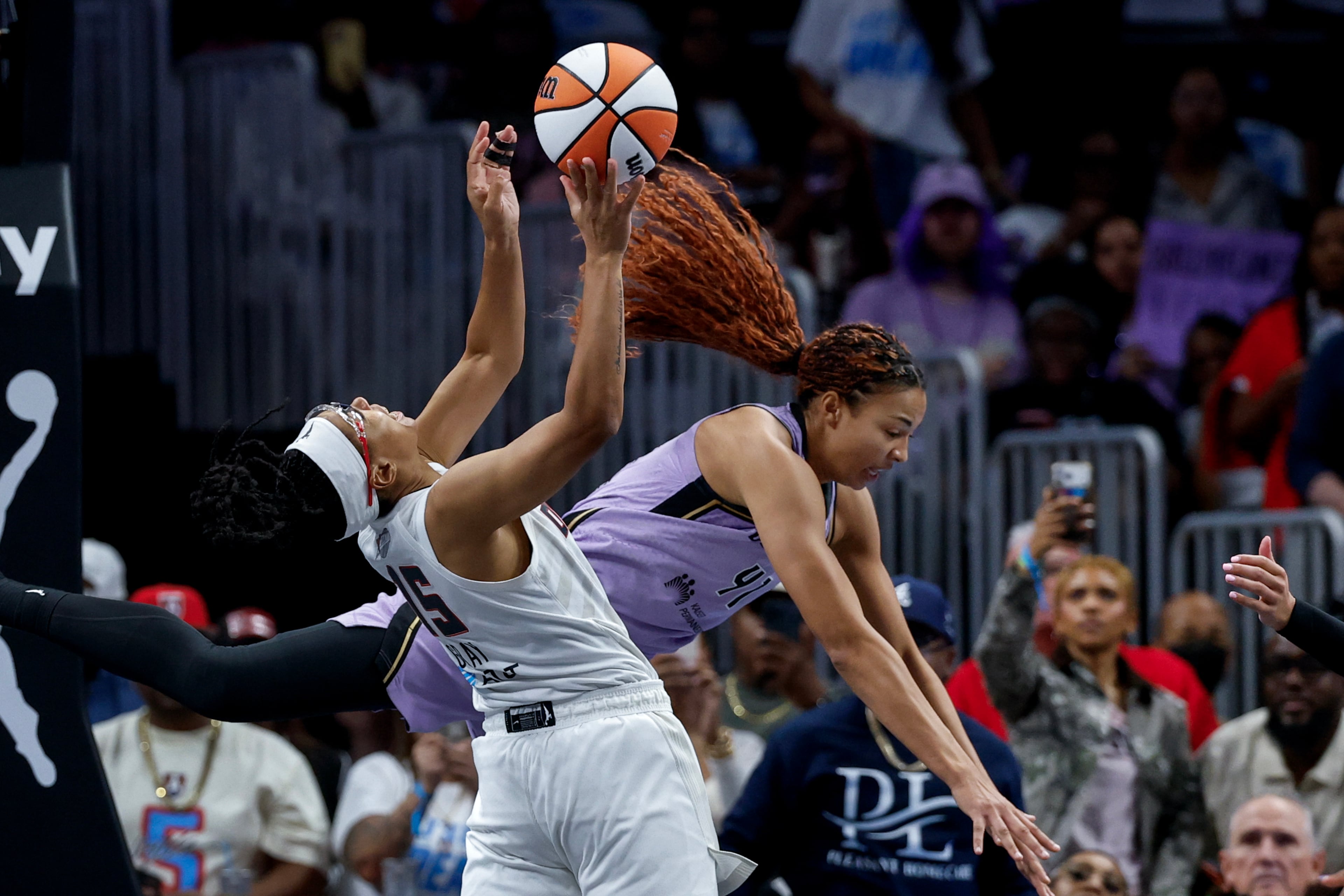 Atlanta Dream guard Allisha Gray (left) is fouled by Golden State Valkyries center Kiah Stokes during the first half of Game 4 of the WNBA Finals between the Atlanta Dream and the Golden State Valkyries, Saturday, Oct. 24, 2026, in Atlanta. (Erik S. Lesser for the AJC)
