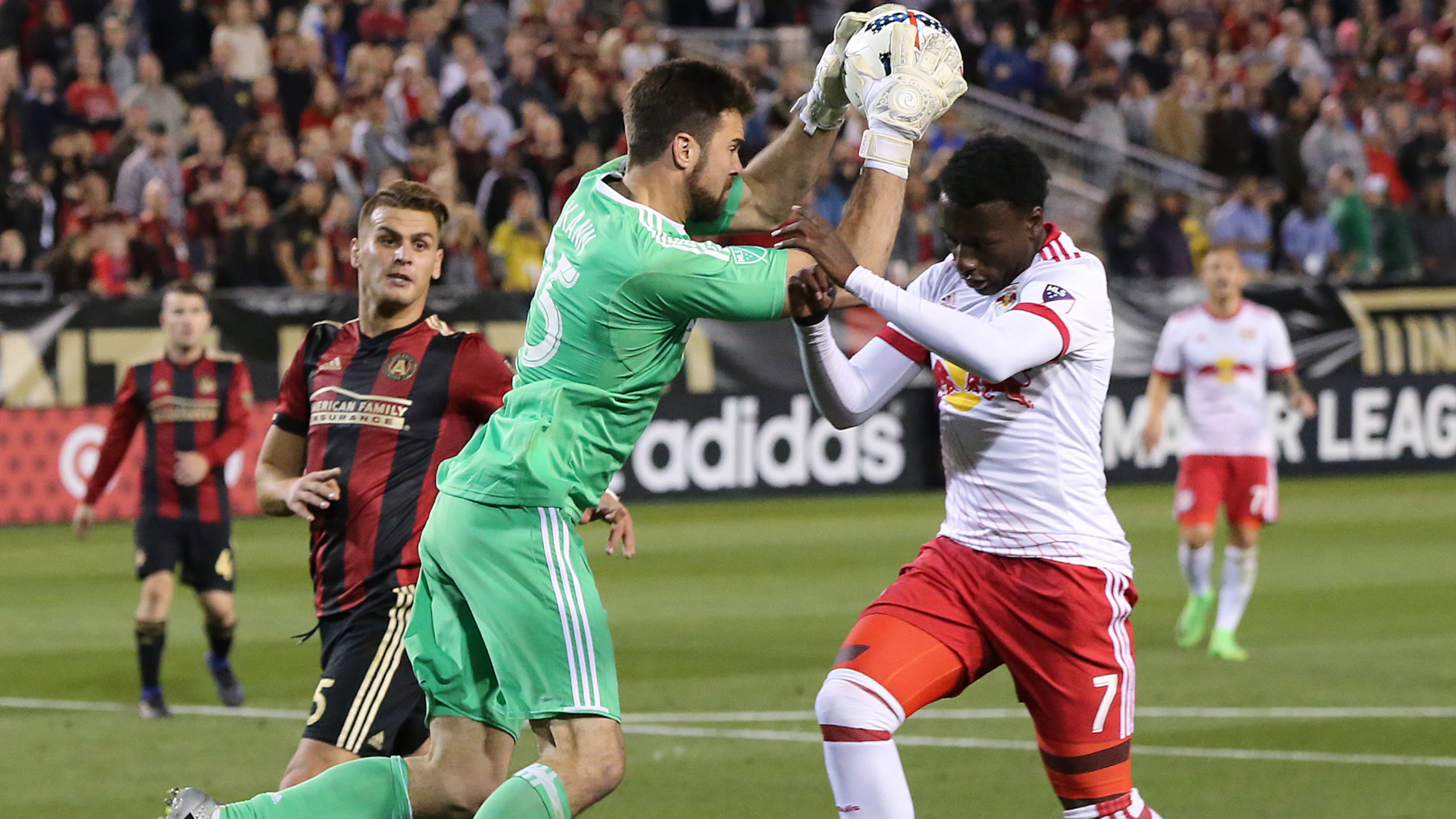 Atlanta United RC N.Y. goalkeeper Alec Kann blocks a shot by Red Bulls Derrick Etienne during the second half in the first game in franchise history on Sunday, March 5, 2017, in Atlanta. Curtis Compton/ccompton@ajc.com