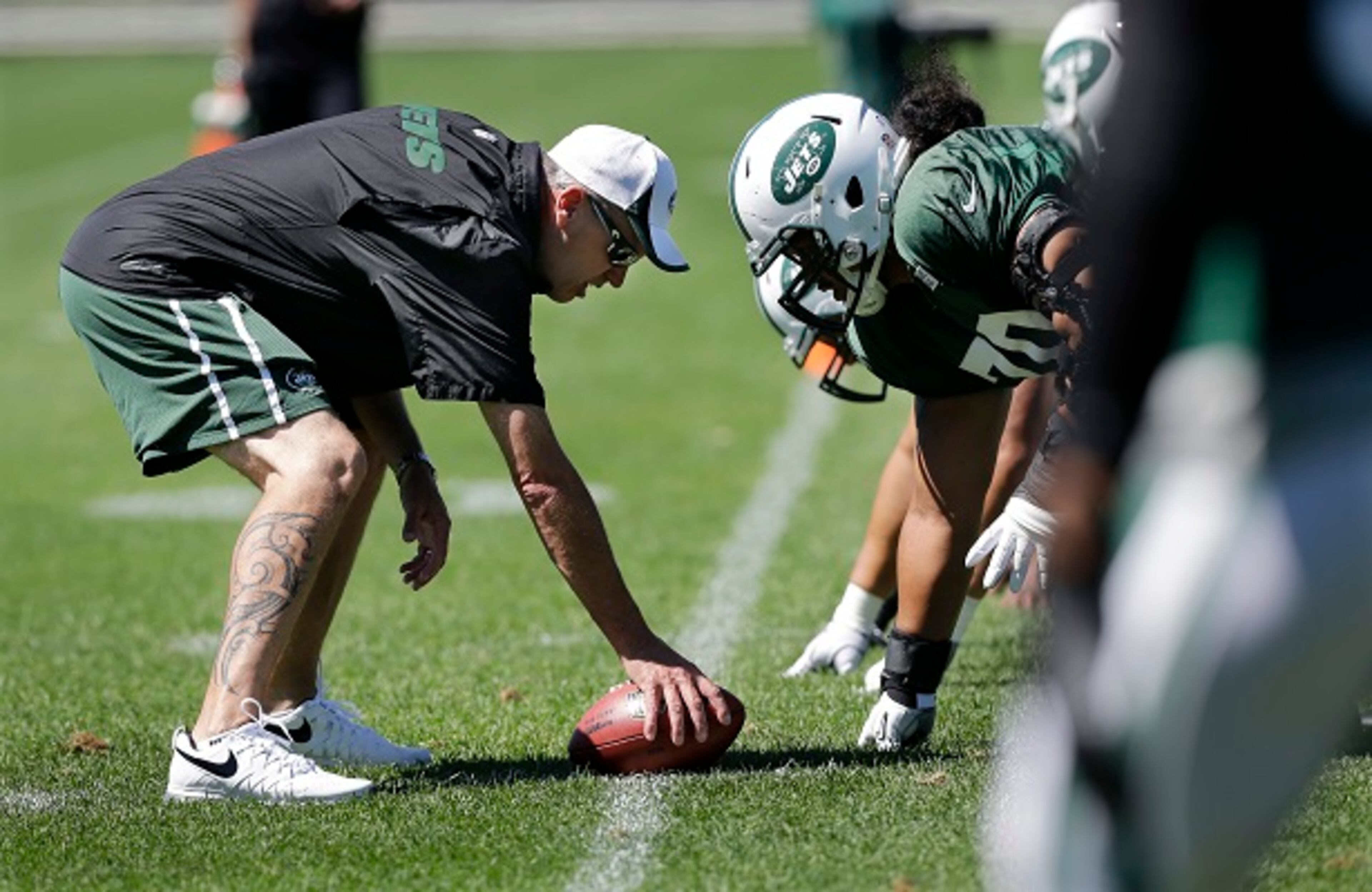 FILE- In this Sept. 4, 2013, file photo, New York Jets head coach Rex Ryan lines up over the ball against defensive players during football practice in Florham Park, N.J. The New York Jets owner Woody Johnson fired Ryan on Monday, Dec. 29, 2014, one day after one of the most disappointing seasons in franchise history. (AP Photo/Mel Evans, File) Would this man hike PSL sales? (Mel Evans/AP photo)