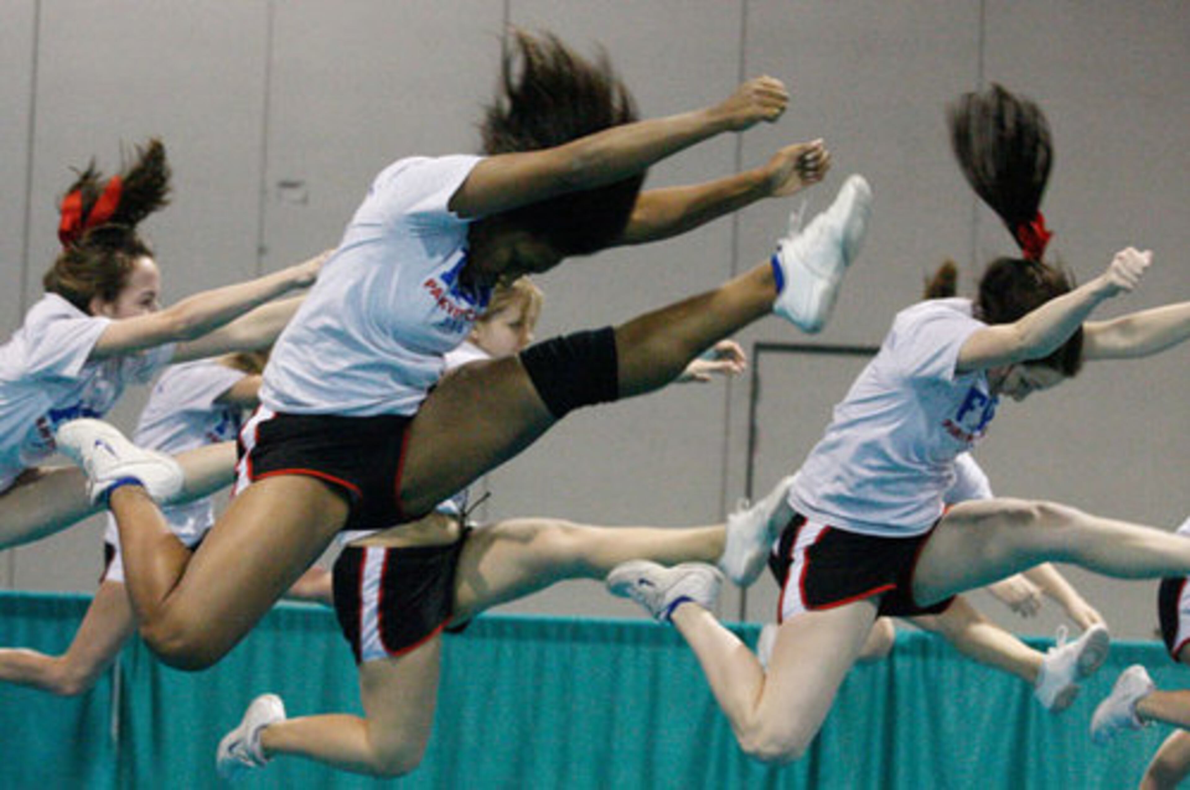 Ardean Leonard (left) and her cheer team from Baton Rouge, La., go through their routine.