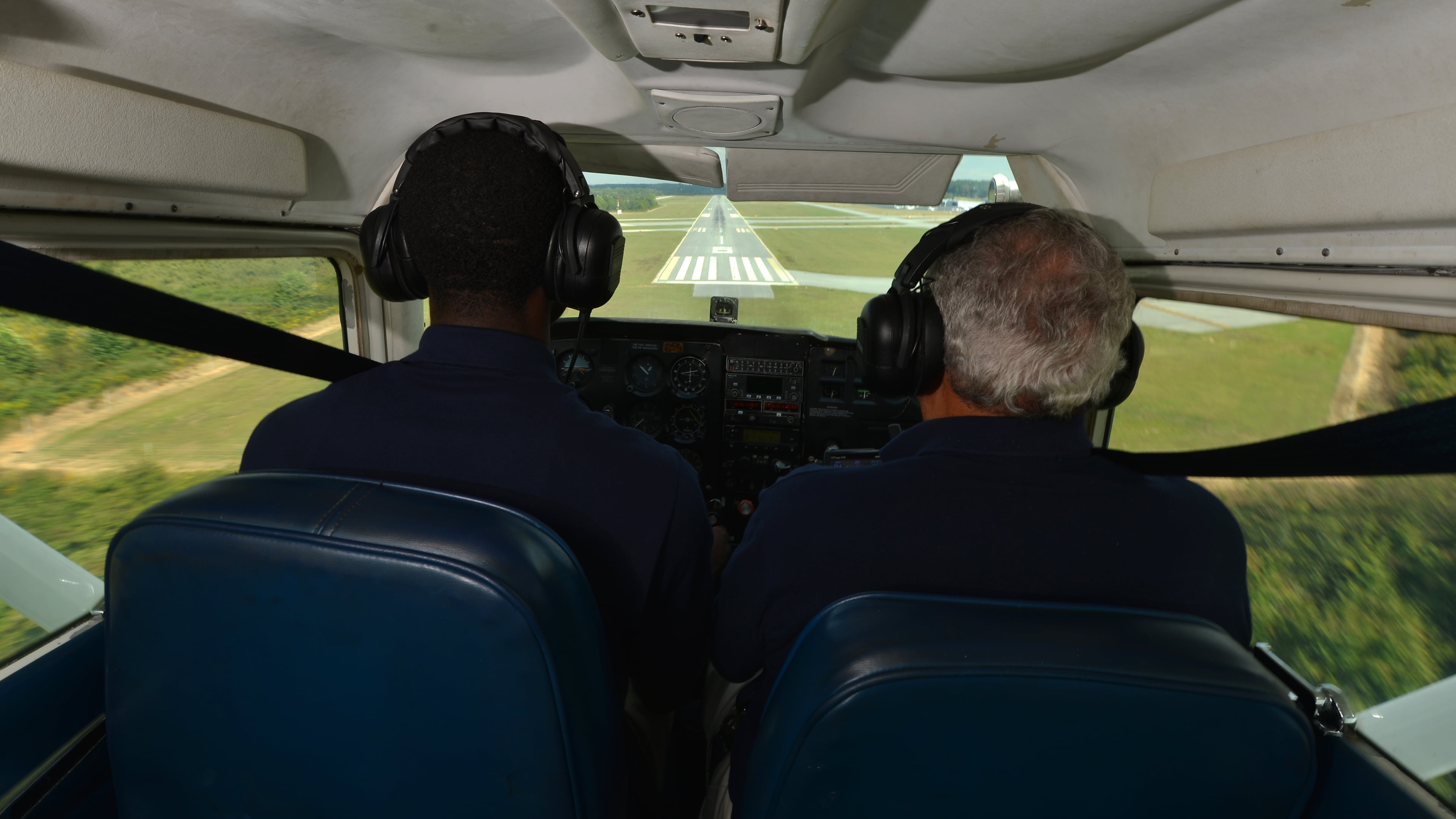 October 3, 2013 Atlanta: Julius Alexander, founder of Aviation Career Enrichment (ACE) coaches student Cayman Howard, 19, in for a landing Thursday October 3, 2013. ACE begin in 1980 as a way to introduce disadvantaged, at-risk and minority youth to aviation opportunities. To date Alexander has instructed 171 students to their first solo flight. BRANT SANDERLIN /BSANDERLIN@AJC.COM