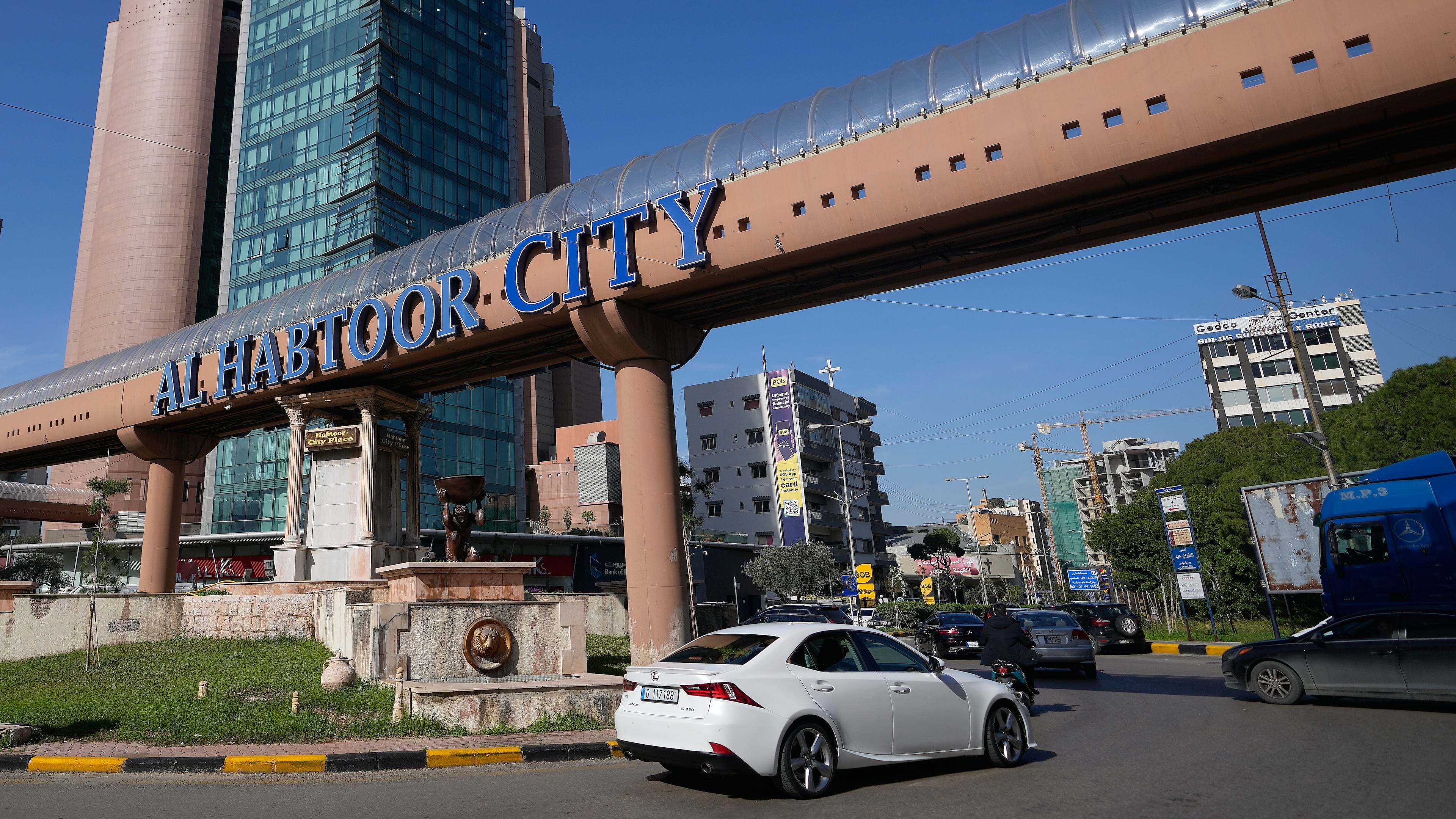 Cars pass next to Habtoor hotel, left, in Beirut, Lebanon, Monday, Jan. 26, 2026. (AP Photo/Hassan Ammar)