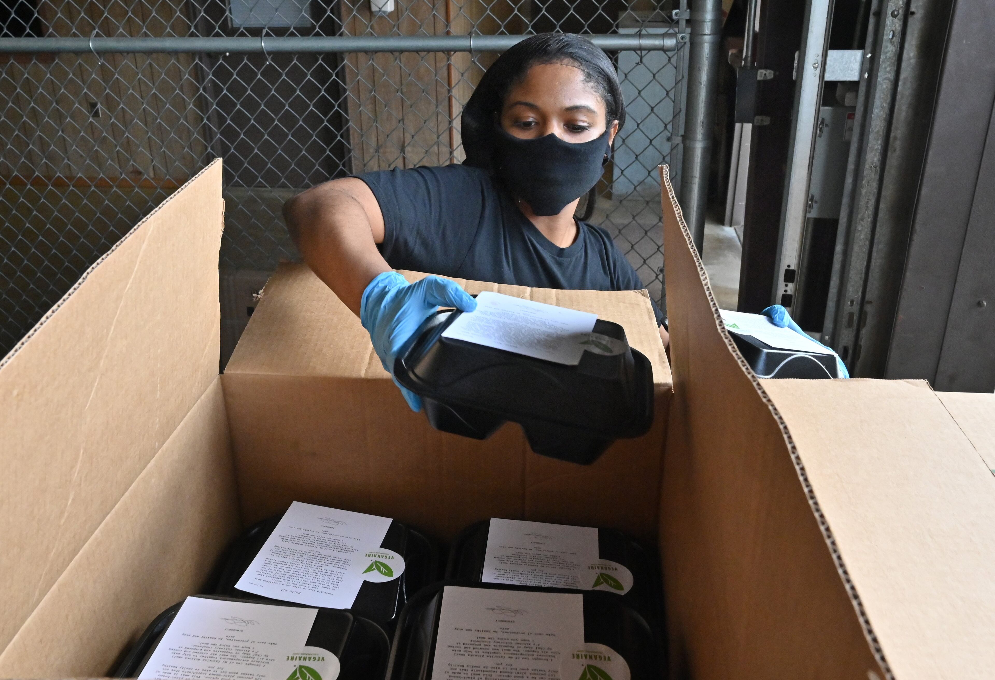 May 21, 2020 Jonesboro - Chef Shay shows off a plant based healthy meal at Clayton Schools maintenance warehouse in Jonesboro on Thursday, May 21, 2020. Also, Jâs Kitchen Culinary Incubator restaurant owned by Usherâs mother, Jonnetta Patton, prepared and delivered the meals. (Hyosub Shin / Hyosub.Shin@ajc.com)