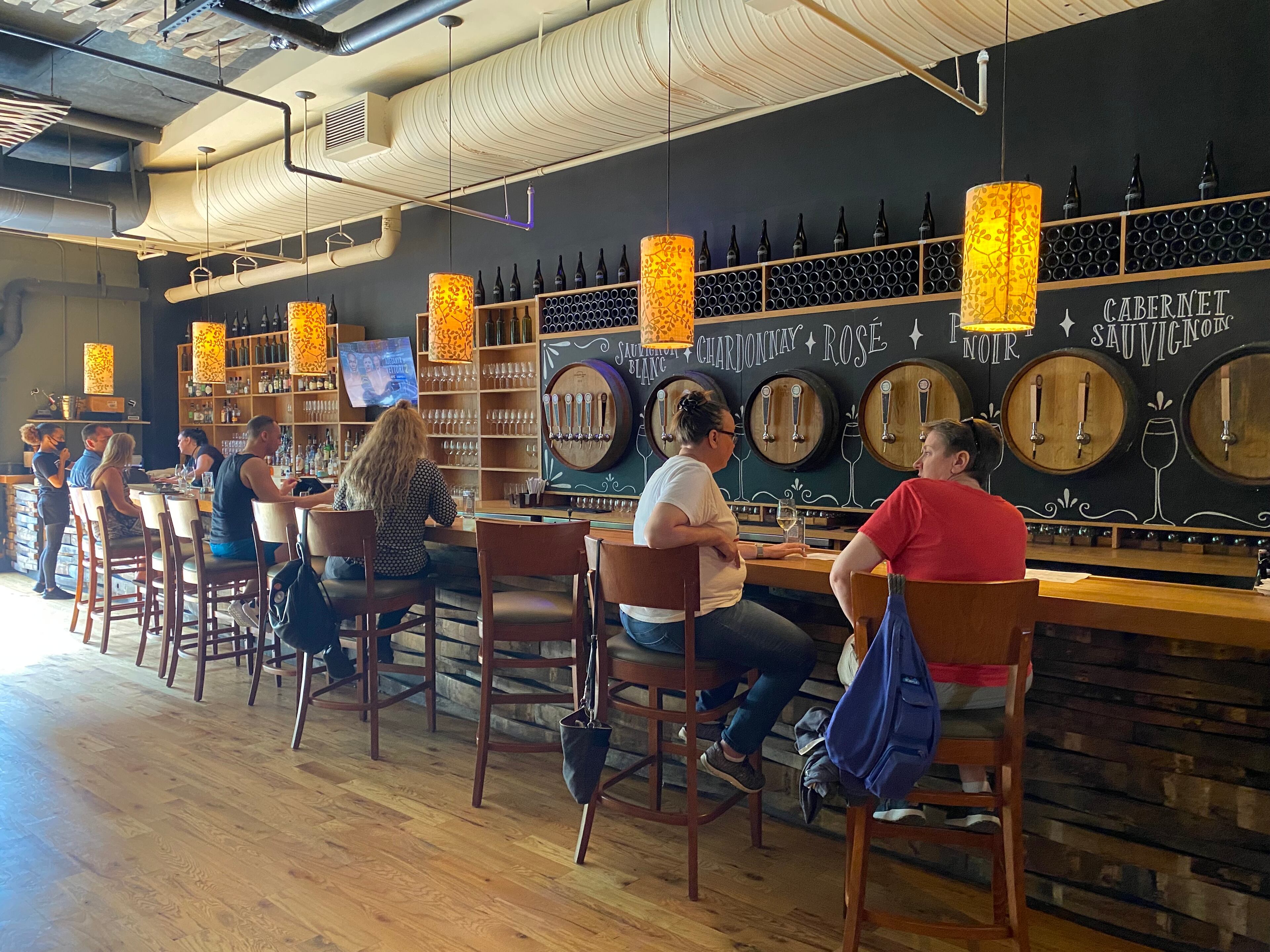 A handful of City Winery patrons enjoy a drink at the bar. (Ligaya Figueras / ligaya.figueras@ajc.com)