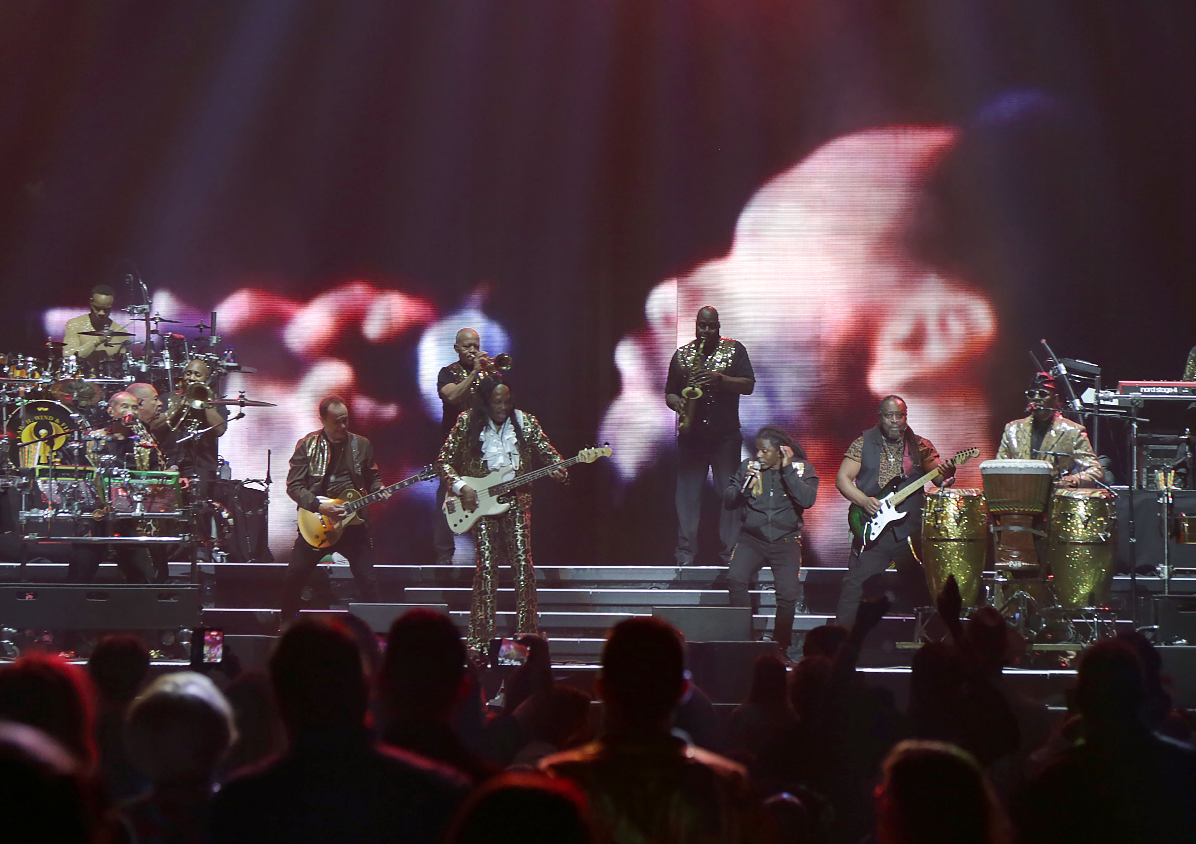 The iconic Earth, Wind & Fire perform at State Farm Arena on Sunday, July 19, 2026. They kicked off their performance singing hits "Shining Star," "Let Your Feelings Show" and "System of Survival." (Akili-Casundria Ramsess for the AJC)