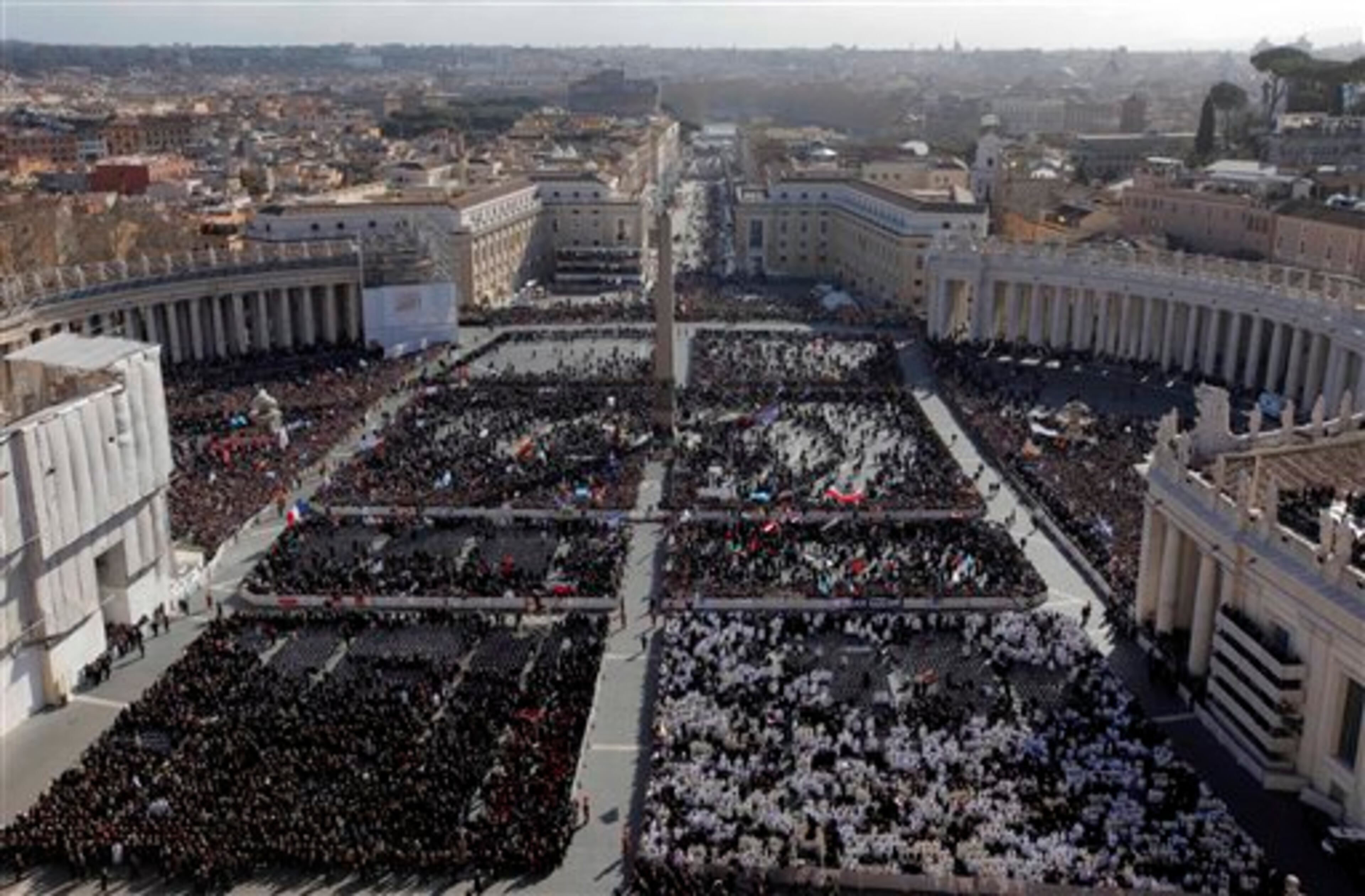 Faithful gather in St. Peter's Square at the Vatican, Tuesday, March 19, 2013. Pope Francis has urged princes, presidents, sheikhs and thousands of ordinary people gathered for his installation Mass to protect God's creation, the weakest and the poorest of the world. (AP Photo/Dmitry Lovetsky)