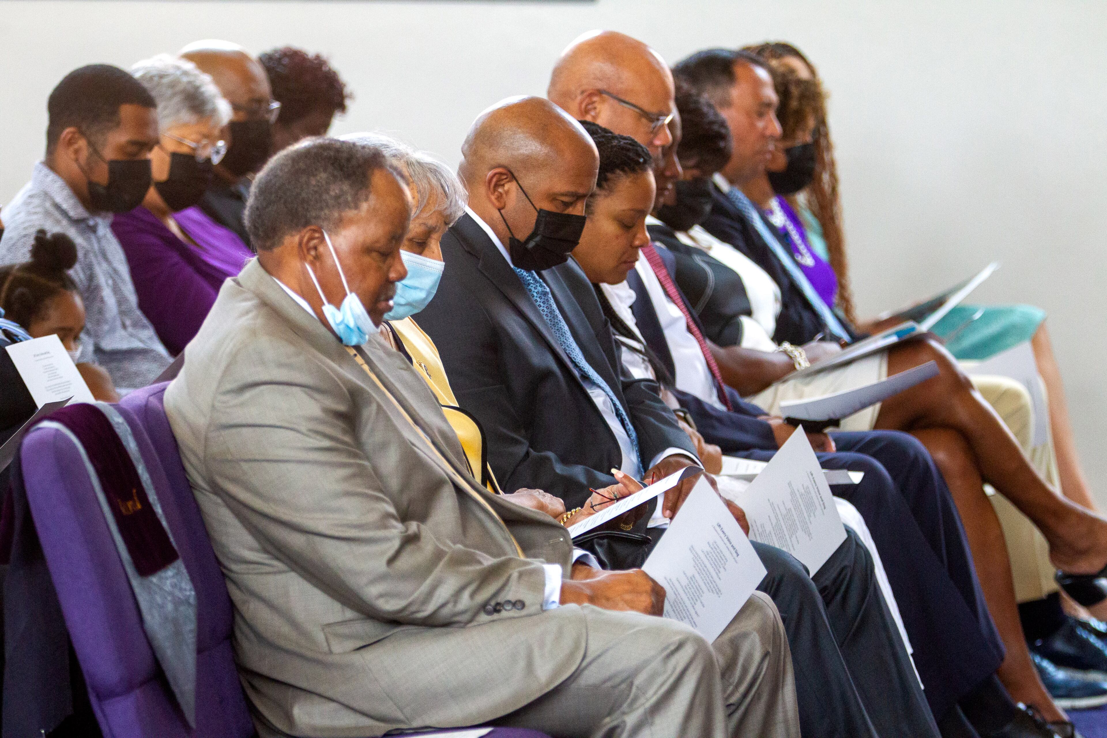 People bow their heads in prayer during the celebration of life and dedication of the Jordan Family Life Center in Vernon Jordan's honor at St. Paul A.M.E. Church on Saturday, July 17, 2021. Jordan died March 1 at age 85. (Photo: Steve Schaefer for The Atlanta Journal-Constitution)