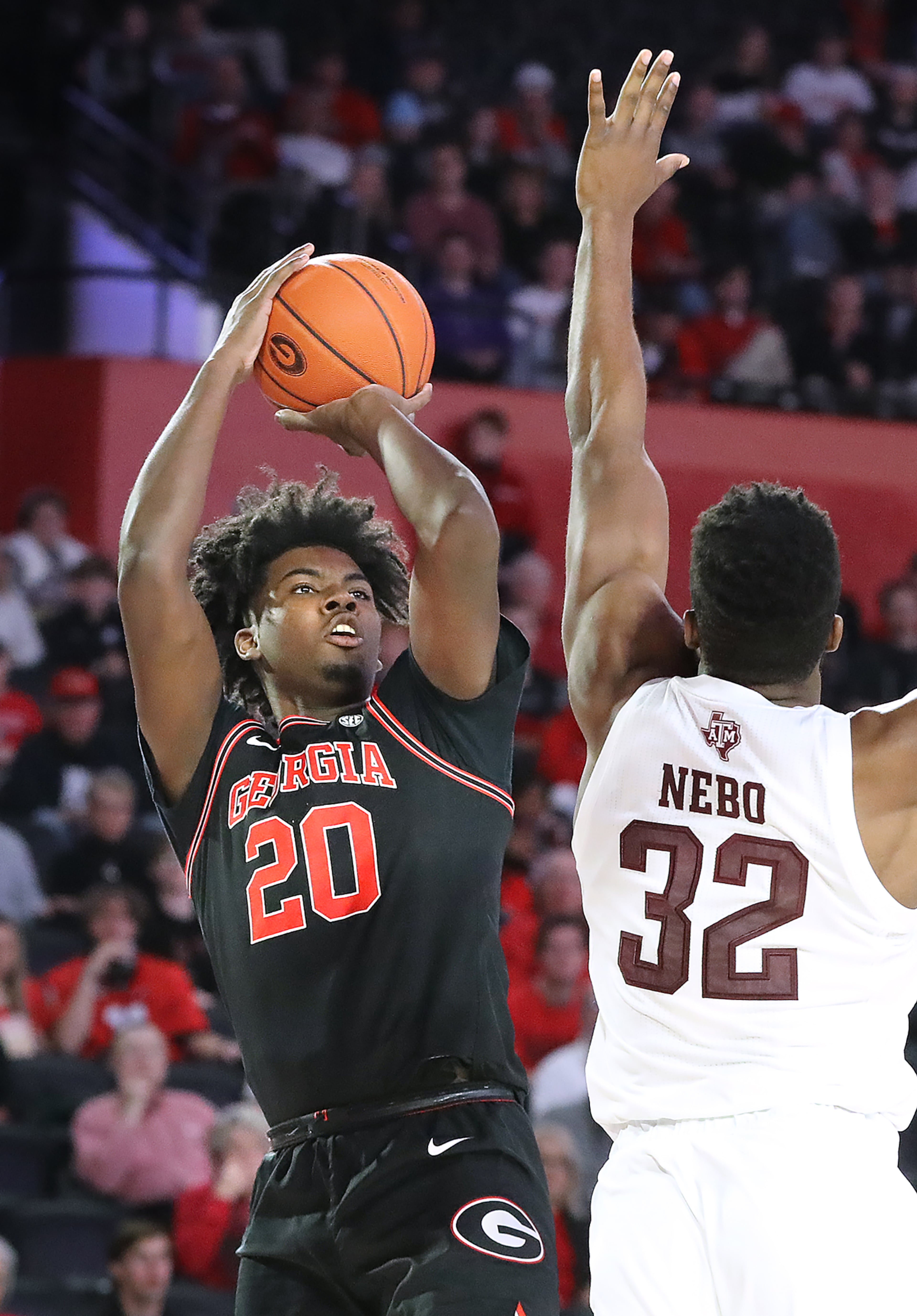 Feb. 1, 2020 Athens: Georgia forward Rayshaun Hammonds hits a three pointer over Texas A&M forward Josh Nebo in a NCAA college basketball game on Saturday, Feb. 1, 2020, in Athens. Curtis Compton ccompton@ajc.com