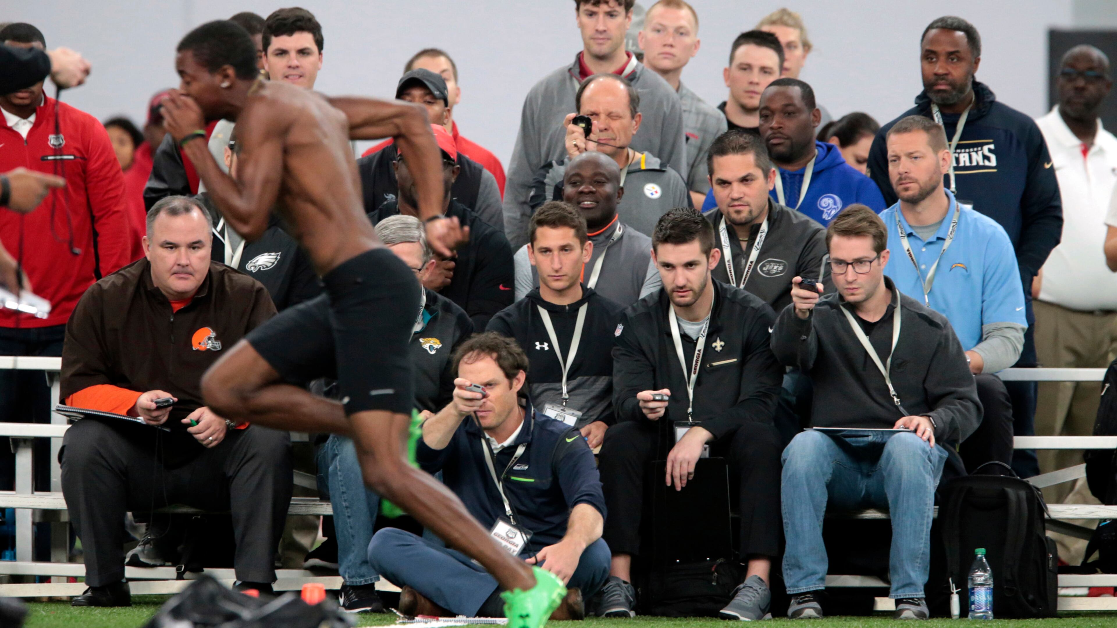 NFL personnel watches as Georgia wide receiver Reggie Davis runs a drill during pro day at the University of Georgia in Athens, Ga., Wednesday, March 15, 2017. (John Roark/Athens Banner-Herald via AP)