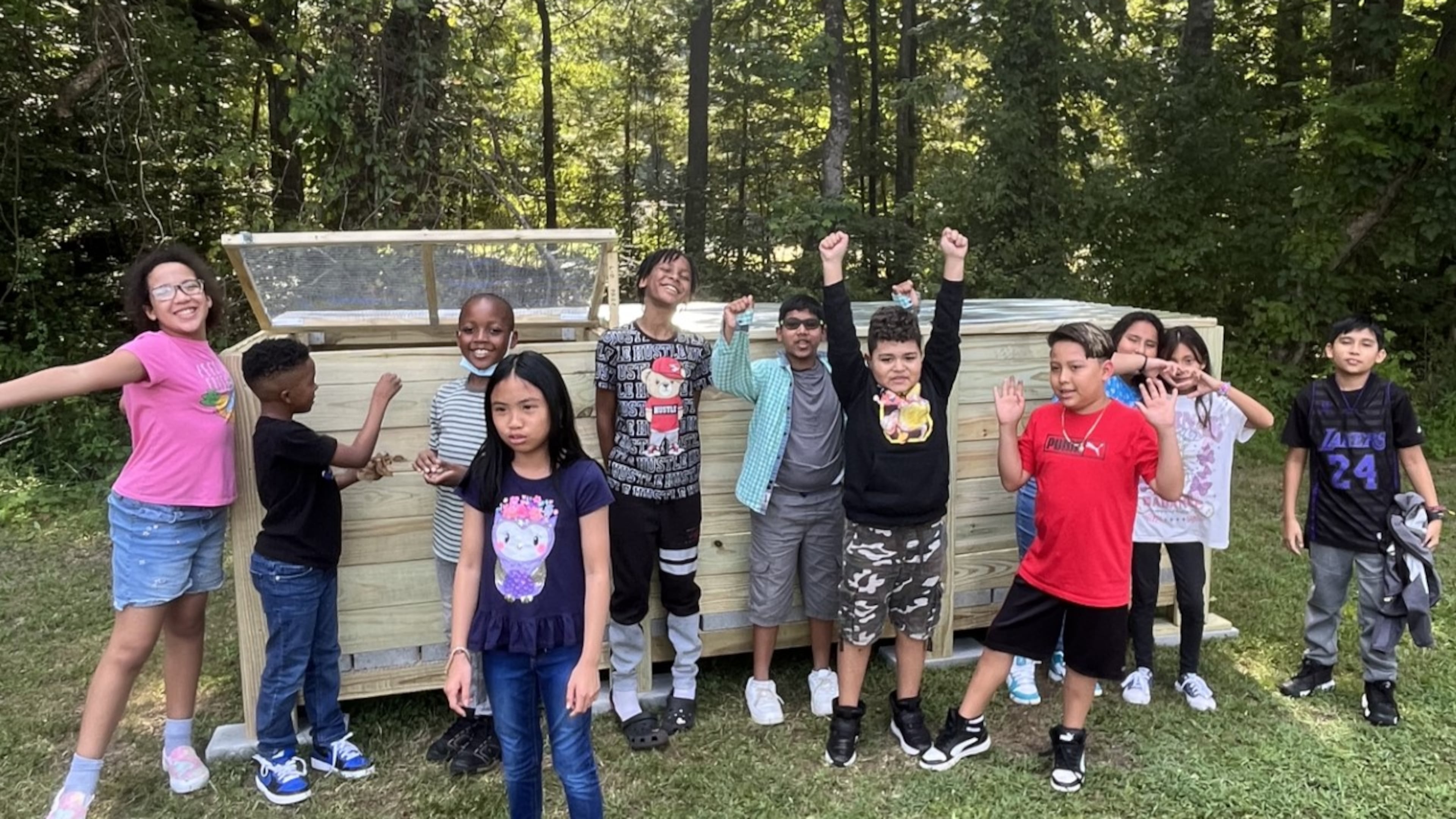 Students at Lilburn Elementary School show off their newly constructed compost bins. (Courtesy Gwinnett Clean & Beautiful)