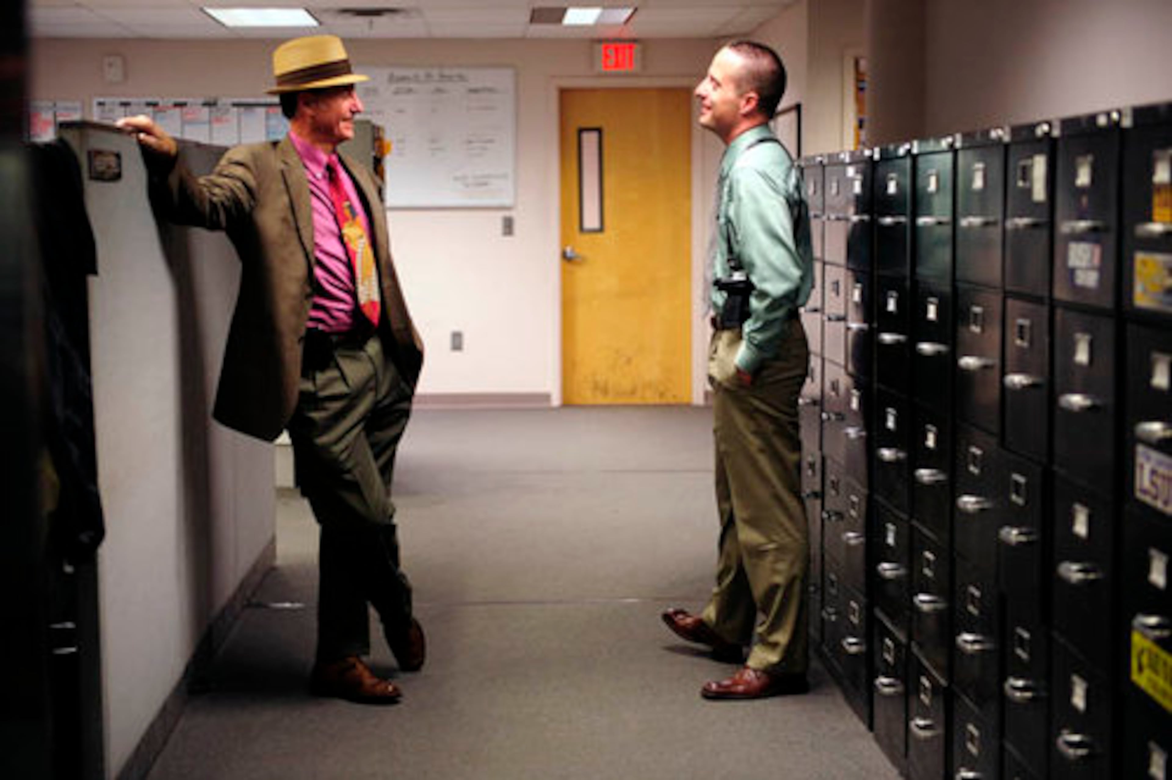 Retired Atlanta police Lt. Danny Agan, left, talks with his son Det. Danny Agan Jr. on a recent visit back to City Hall East. Agan Sr. brought the idea of wearing hats back to the squad when he joined the unit in 1979. When he left, his partner Sgt. Charles Horton kept it alive. Agan Sr. also bought his son his first fedora.